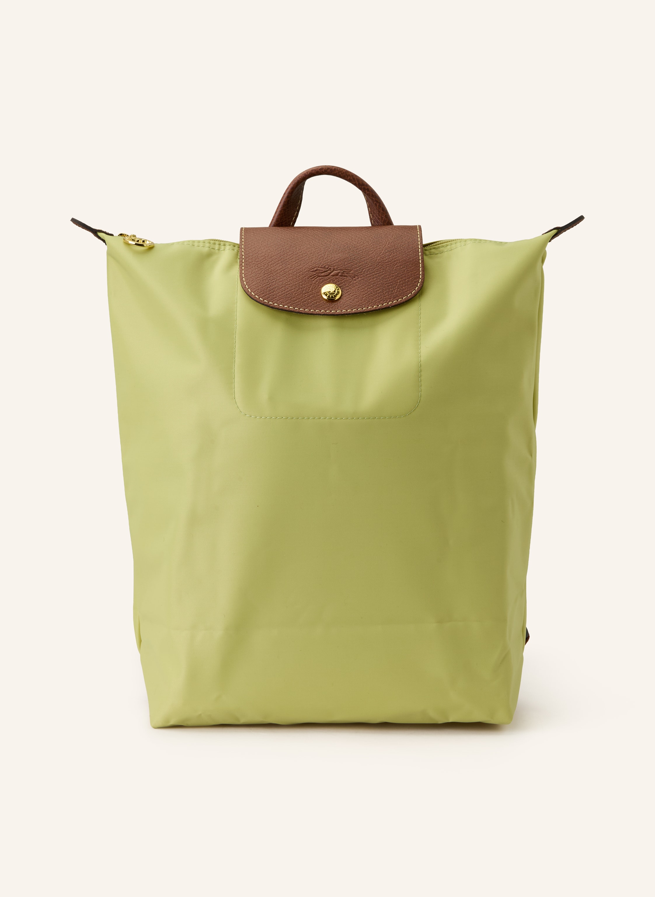 Longchamp Synthetische Verarbeitung mit Lederdetails. Goldfarbene Metalldetails. Schließt mit einem Reißverschluss und Druckknopf. Längenverstellbarer Schulterriemen. Handgriff. Logo-Prägung am Überschlag. Dank Medium in hellgrün / braun