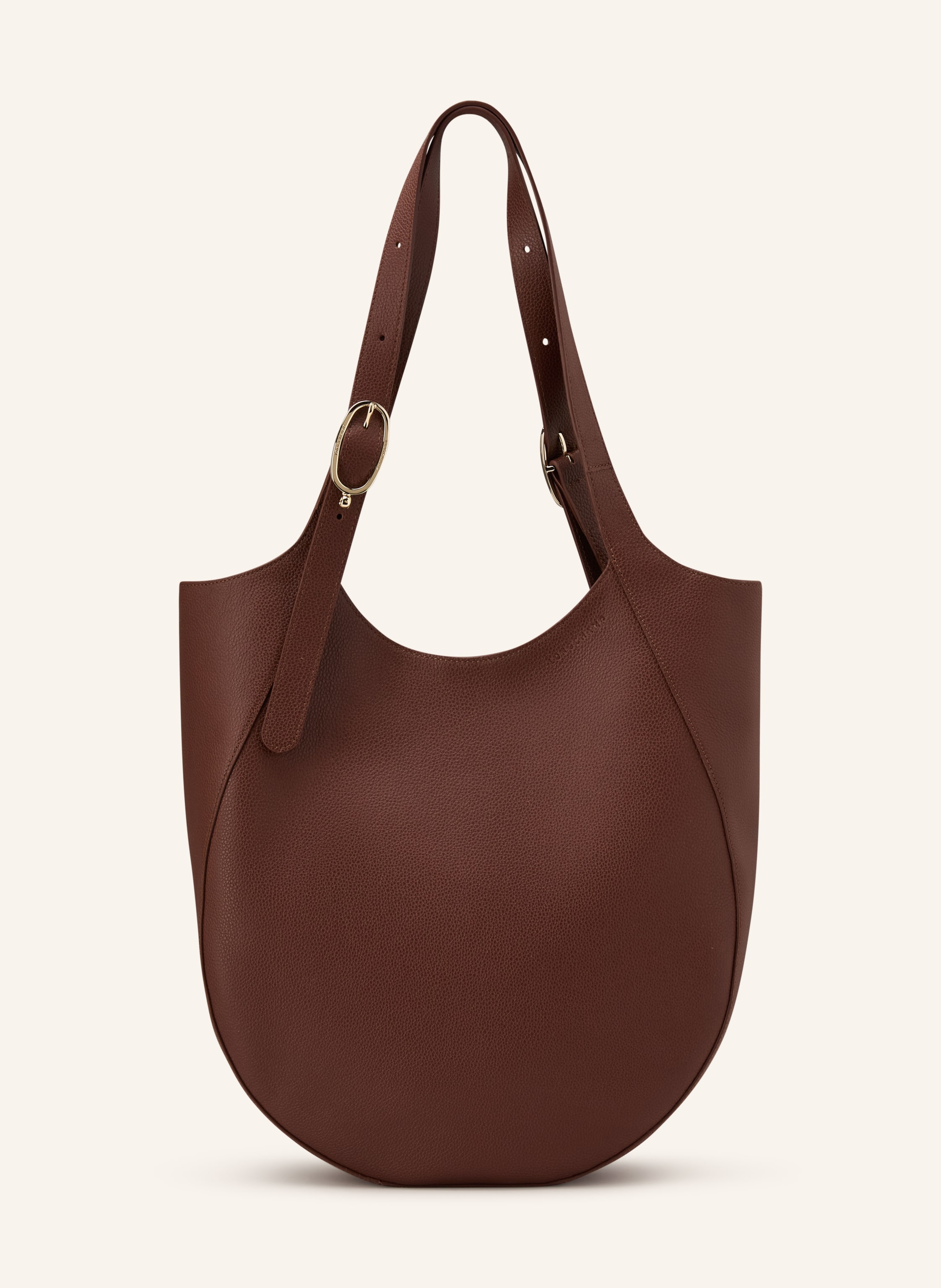 Longchamp Genarbtes Leder. Schließt mit Magnetverschluss. Zwei Tragegriffe. Innen ein Hauptfach. Innenfach mit Reißverschluss. Verstärkter Taschenboden. Label-Prägung auf der Front in braun