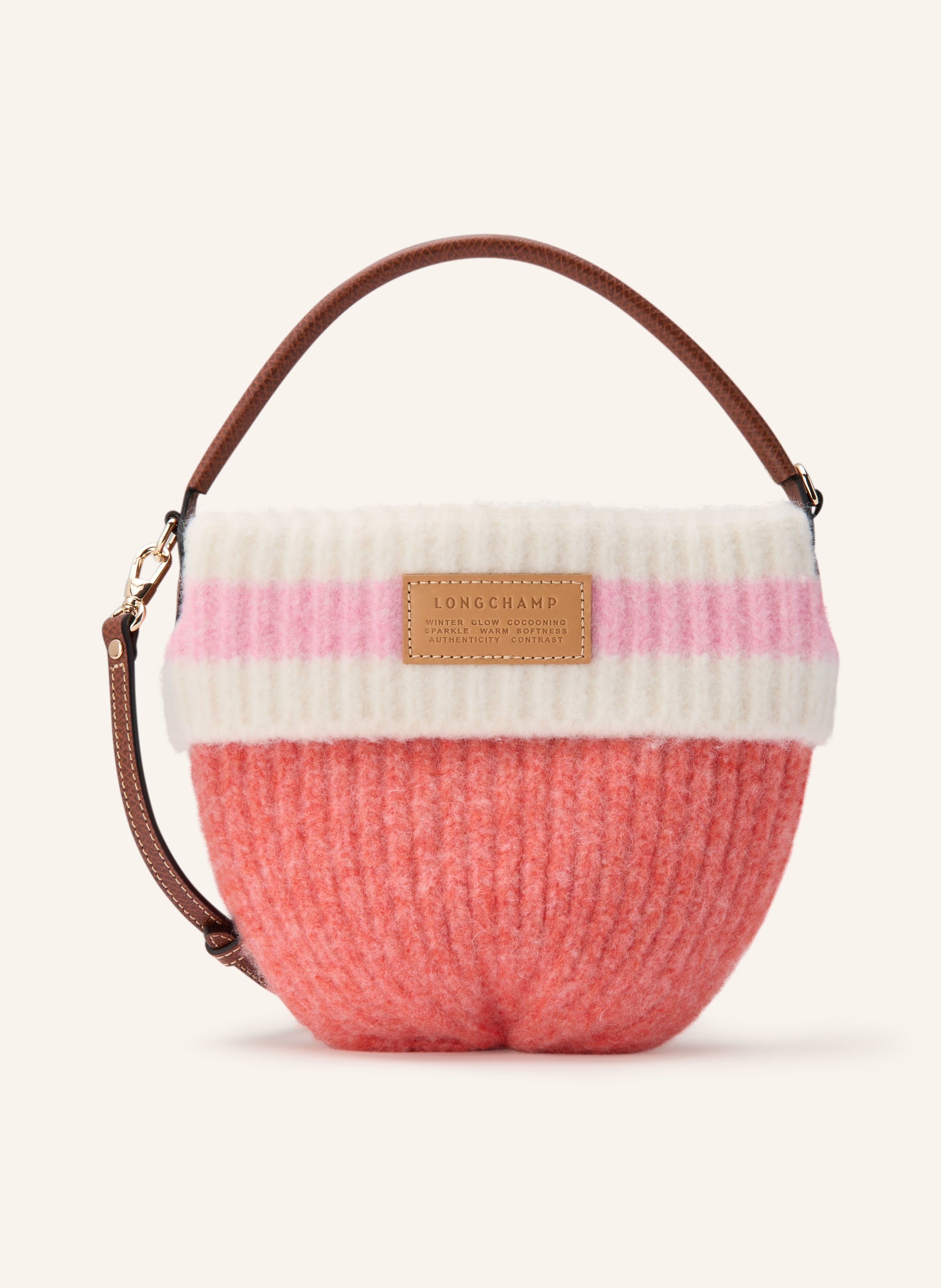 Longchamp Abnehmbarer Schulterriemen. Ein Tragegriff. Längenverstellbarer Schulterriemen. Druckknopf. Innen ein Hauptfach. Label-Detail. Leder. Textil. Allover-Muster in hellrot / gold / braun