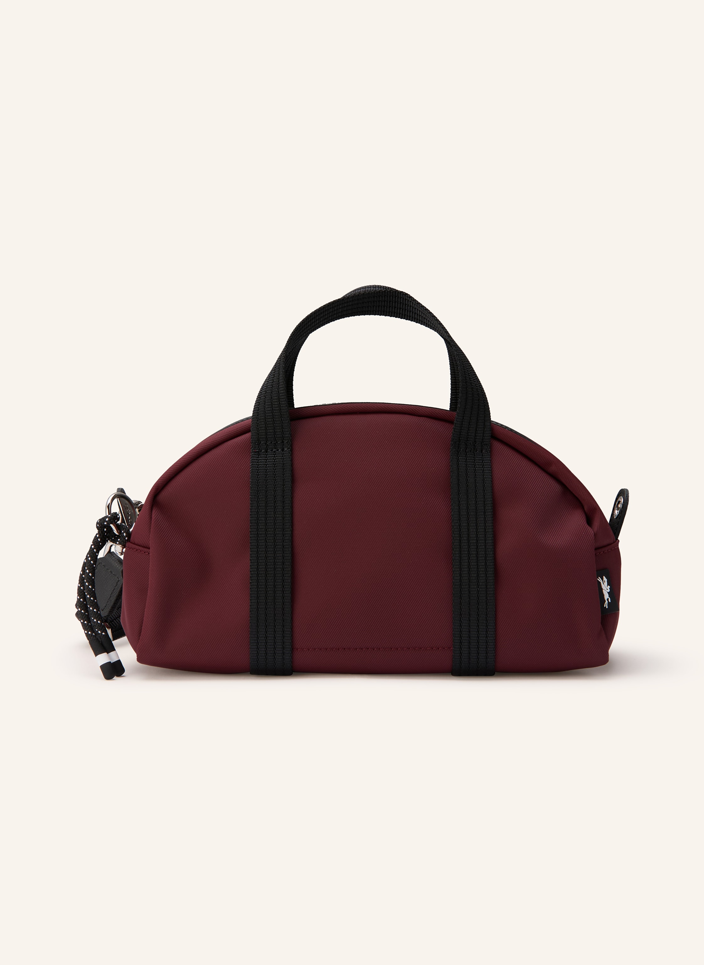 Longchamp Innen ein Hauptfach. Zwei Steckfächer. Abnehmbarer Schulterriemen. Längenverstellbarer Schulterriemen. Zwei Tragegriffe. Reißverschluss. Label-Wording. Textil. Unifarben in dunkelrot / schwarz