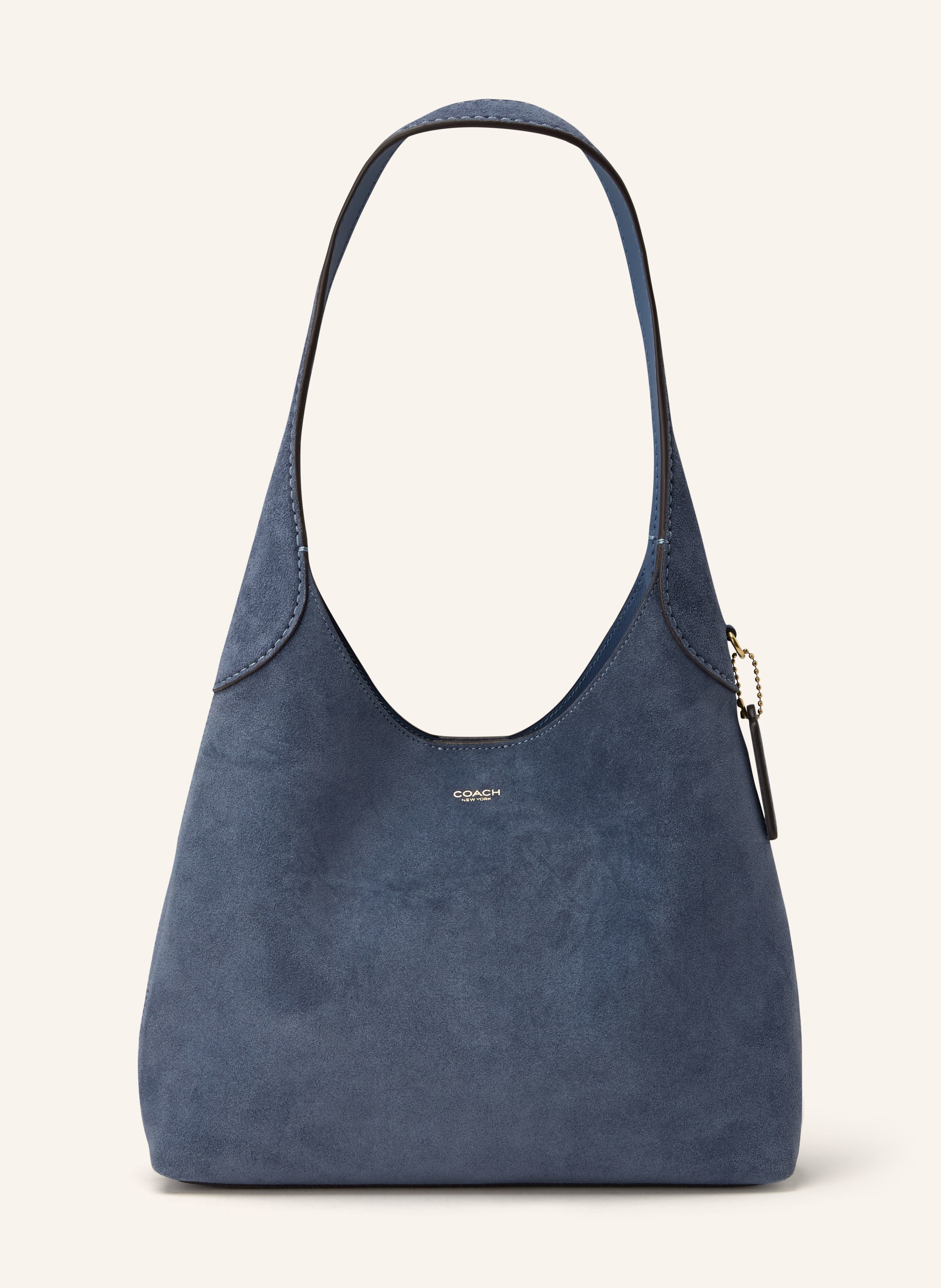 Coach Veloursleder. Schließt mit Magnetverschluss. Ein Tragegriff. Innen ein Hauptfach. Ein Steckfach. Verstärkter Taschenboden. Label-Emblem auf der Front in blau / gold