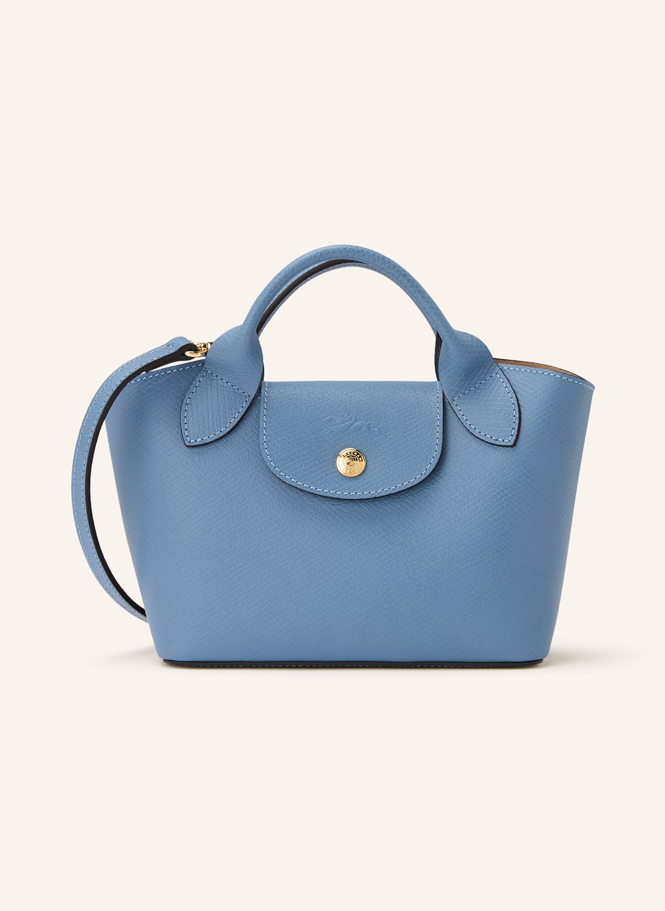 Longchamp Genarbtes Leder. Schließt mit Druckknopf. Zwei Tragegriffe. Abnehmbarer, längenverstellbarer Schulterriemen. Innen ein Hauptfach. Ein Steckfach. Verstärkter Taschenboden. Label-Prägung auf dem Übersch in hellblau / gold