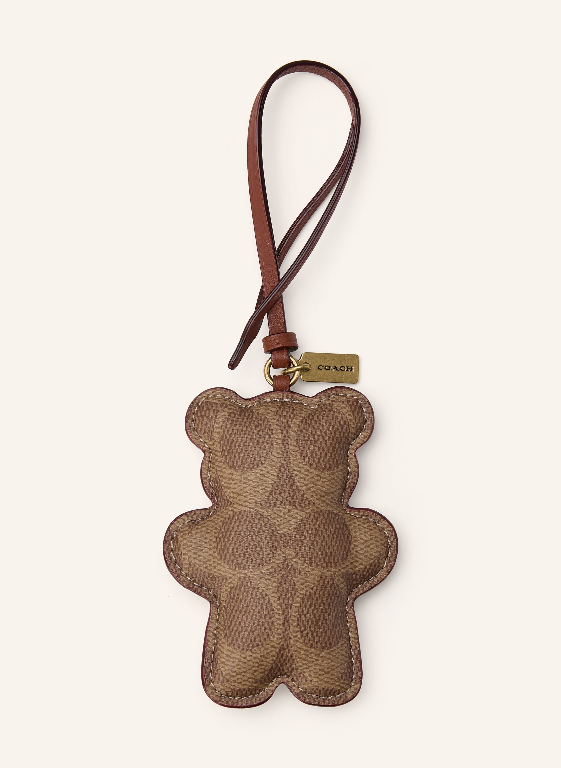 Coach Beschichtetes Canvas. Lederdetails. Goldfarbene Metalldetails. Bicolor-Design in camel / braun