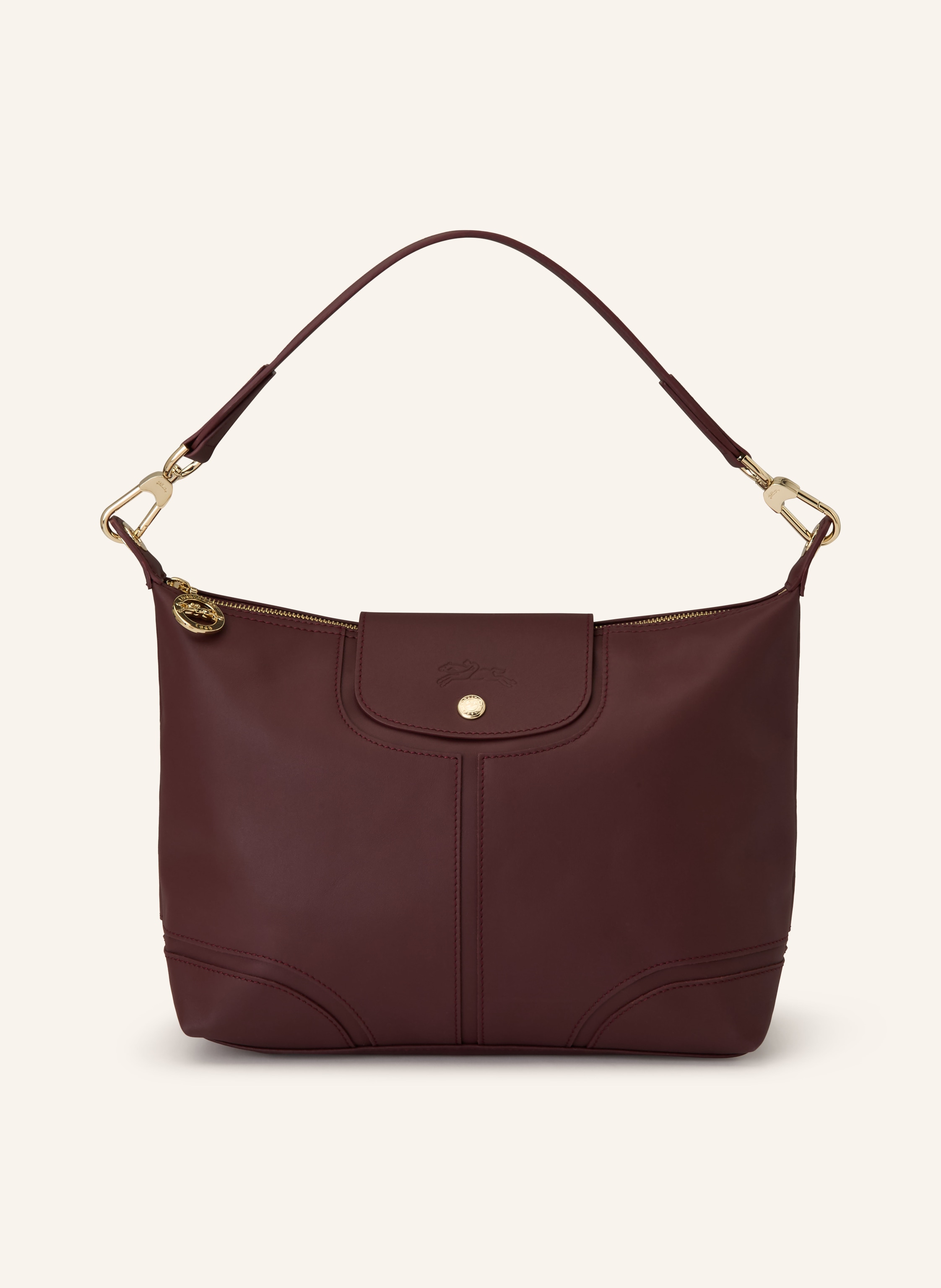 Longchamp Ein Innenfach mit Reißverschluss. Ein Steckfach. Abnehmbarer Schulterriemen. Druckknopf. Reißverschluss. Innen ein Hauptfach. Label-Anhänger. Label-Detail. Glattleder. Unifarben in dunkelrot