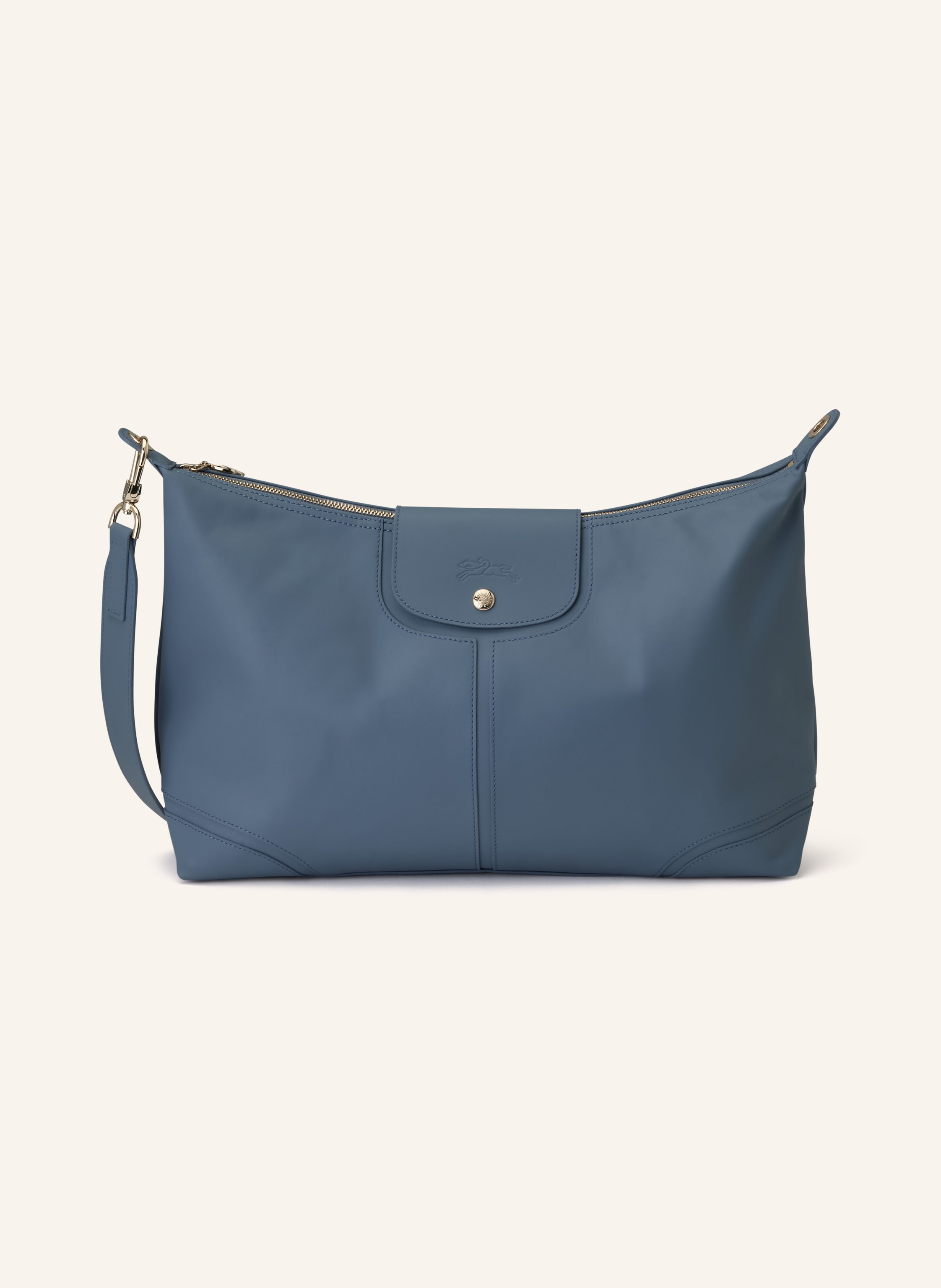 Longchamp Ein Innenfach mit Reißverschluss. Ein Steckfach. Abnehmbarer Schulterriemen. Druckknopf. Reißverschluss. Innen ein Hauptfach. Label-Anhänger. Fein genarbtes Leder. Unifarben in hellblau