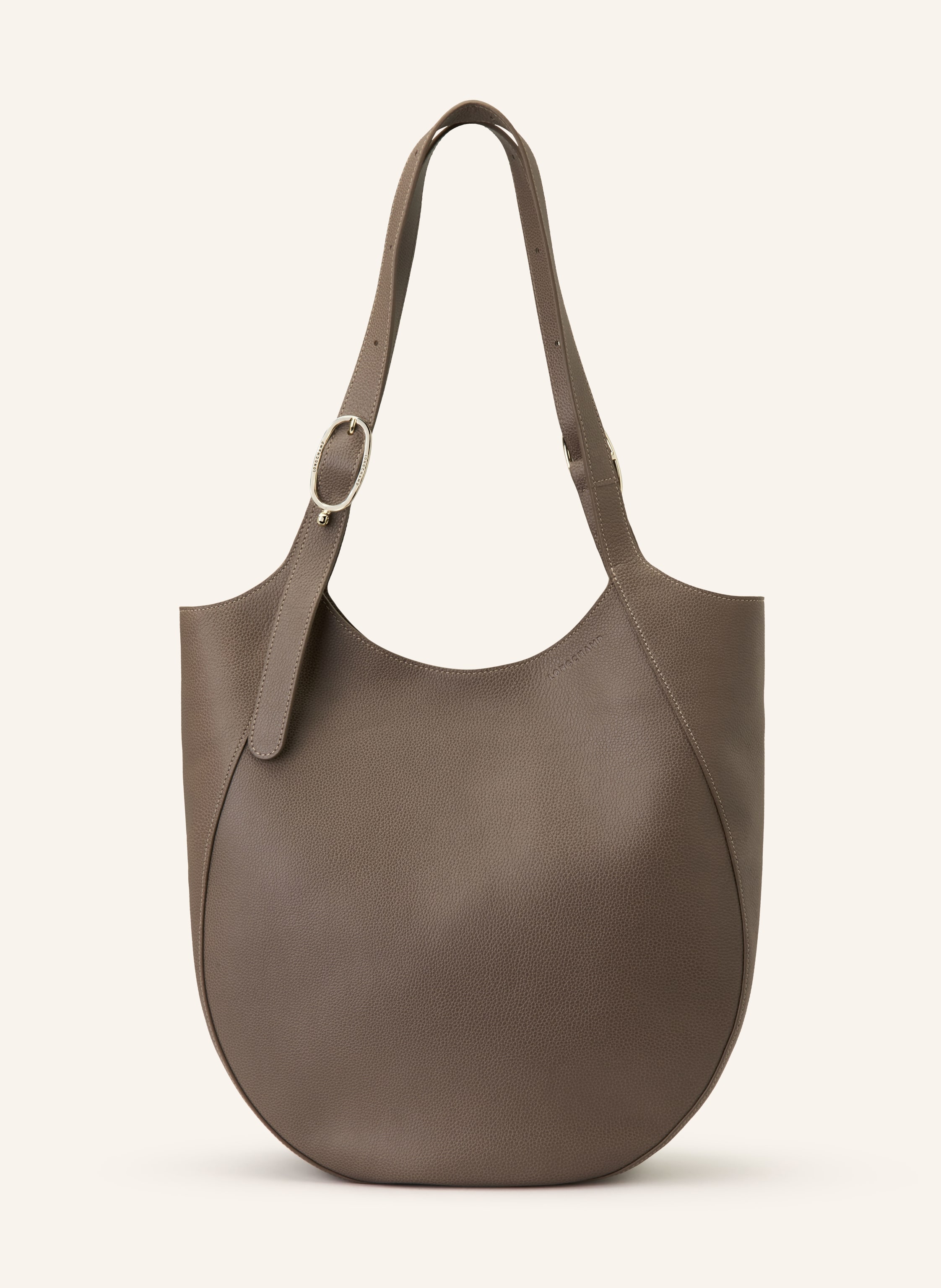 Longchamp Genarbtes Leder. Schließt mit Magnetverschluss. Zwei Tragegriffe. Innen ein Hauptfach. Innenfach mit Reißverschluss. Verstärkter Taschenboden. Label-Prägung auf der Front in taupe / gold