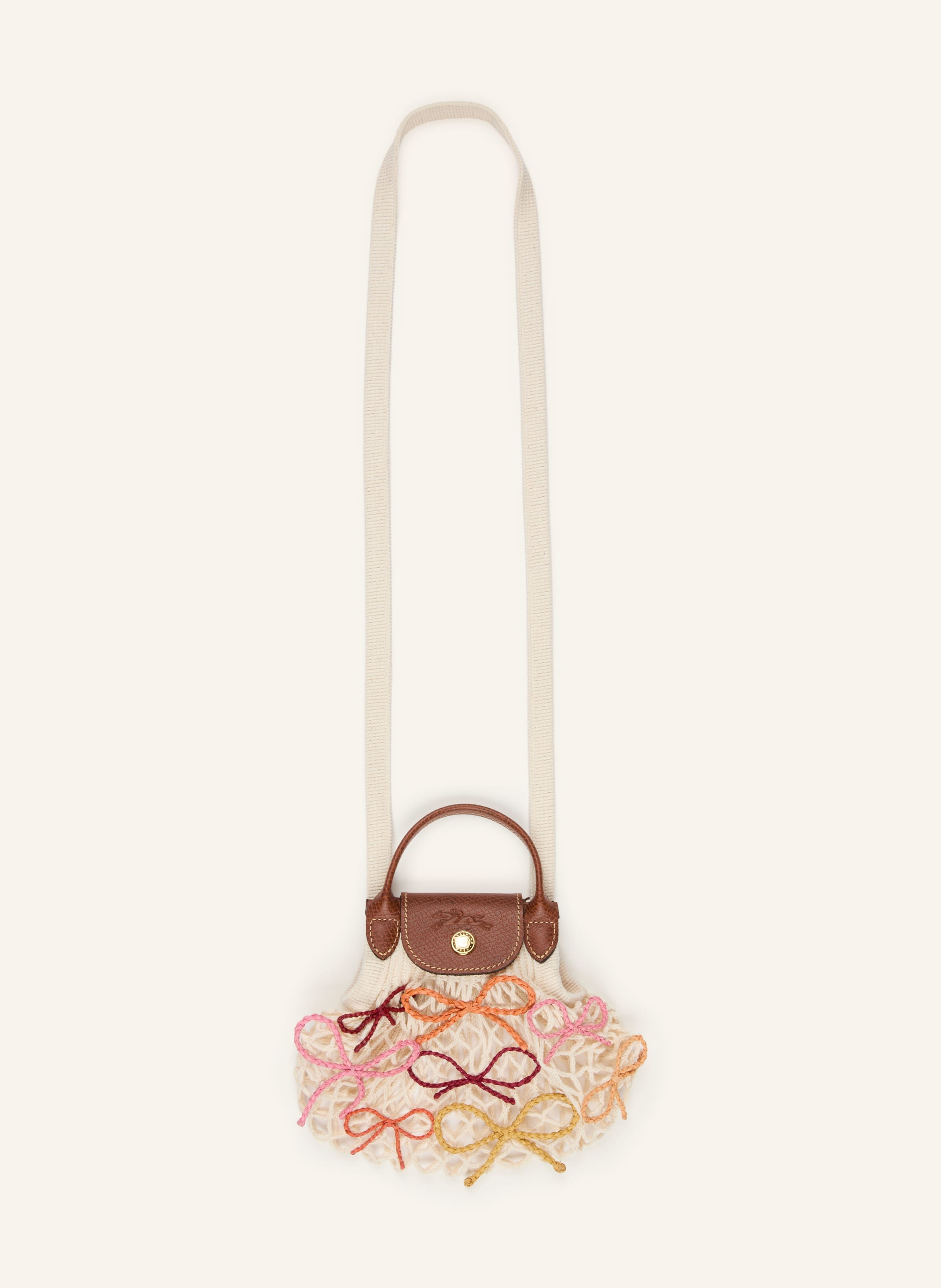 Longchamp Ein Tragegriff. Fixierter Schulterriemen. Druckknopf. Überschlag. Innen ein Hauptfach. Label-Details. Bast. Leder mit Struktur. Strickqualität. Multicolor-Design. Schleifendetails. Netzstruktur in ecru / gold / dunkelbraun