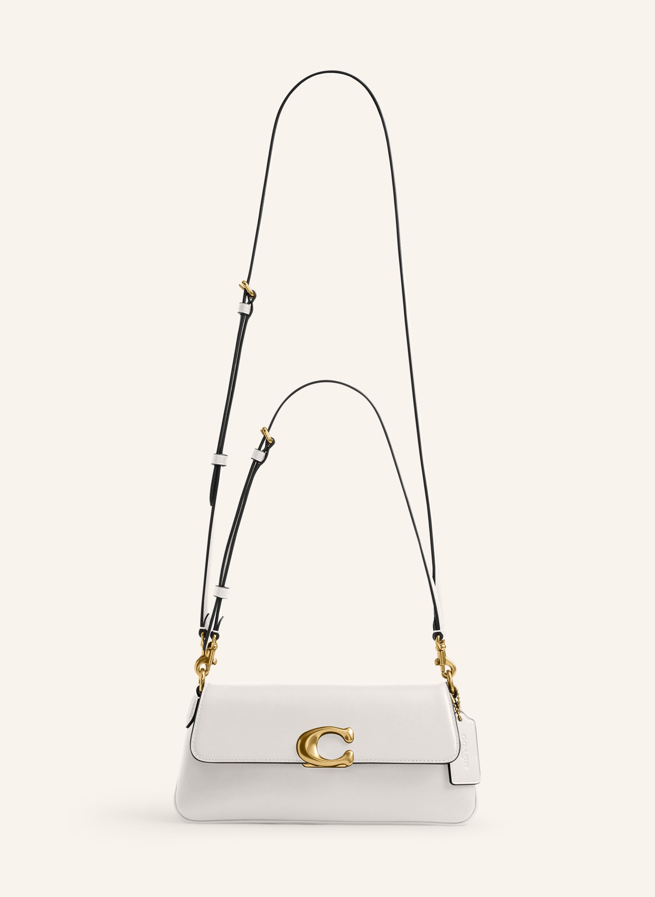 Coach Glattleder. Schließt mit Druckknopf. Längenverstellbarer Schulterriemen. Außenfach hinten. Innen ein Hauptfach. Ein Steckfach für Smartphone & Co. Logo-Applikation auf der Front , in creme / gold