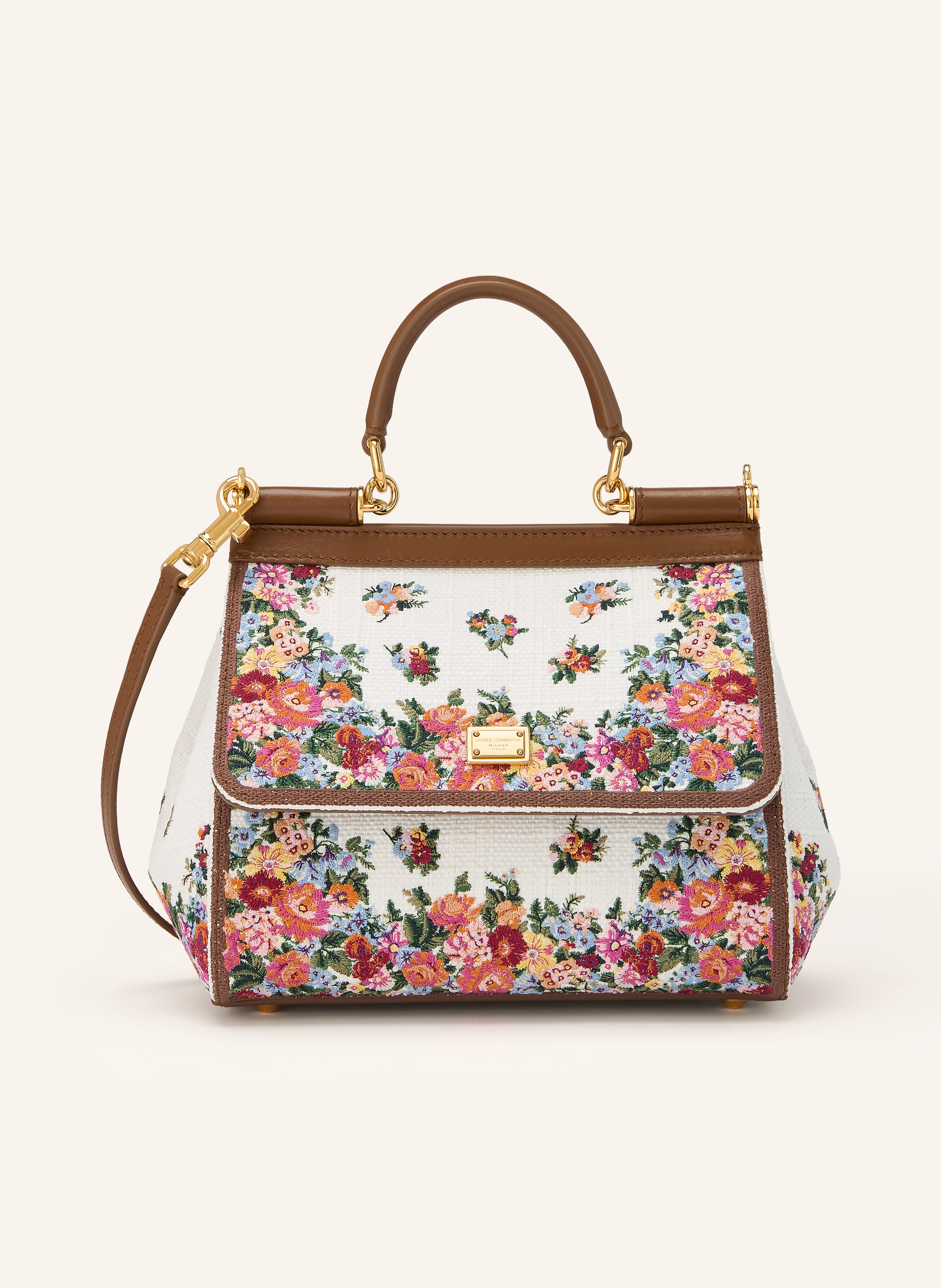 Dolce & Gabbana Ein Kartenfach. Abnehmbarer Schulterriemen. Ein Tragegriff. Längenverstellbarer Schulterriemen. Stellfüßchen. Verstärkter Taschenboden. Steckschließe. Innen ein Hauptfach. Label-Detail. Glattleder. Te Medium in creme / gold / braun