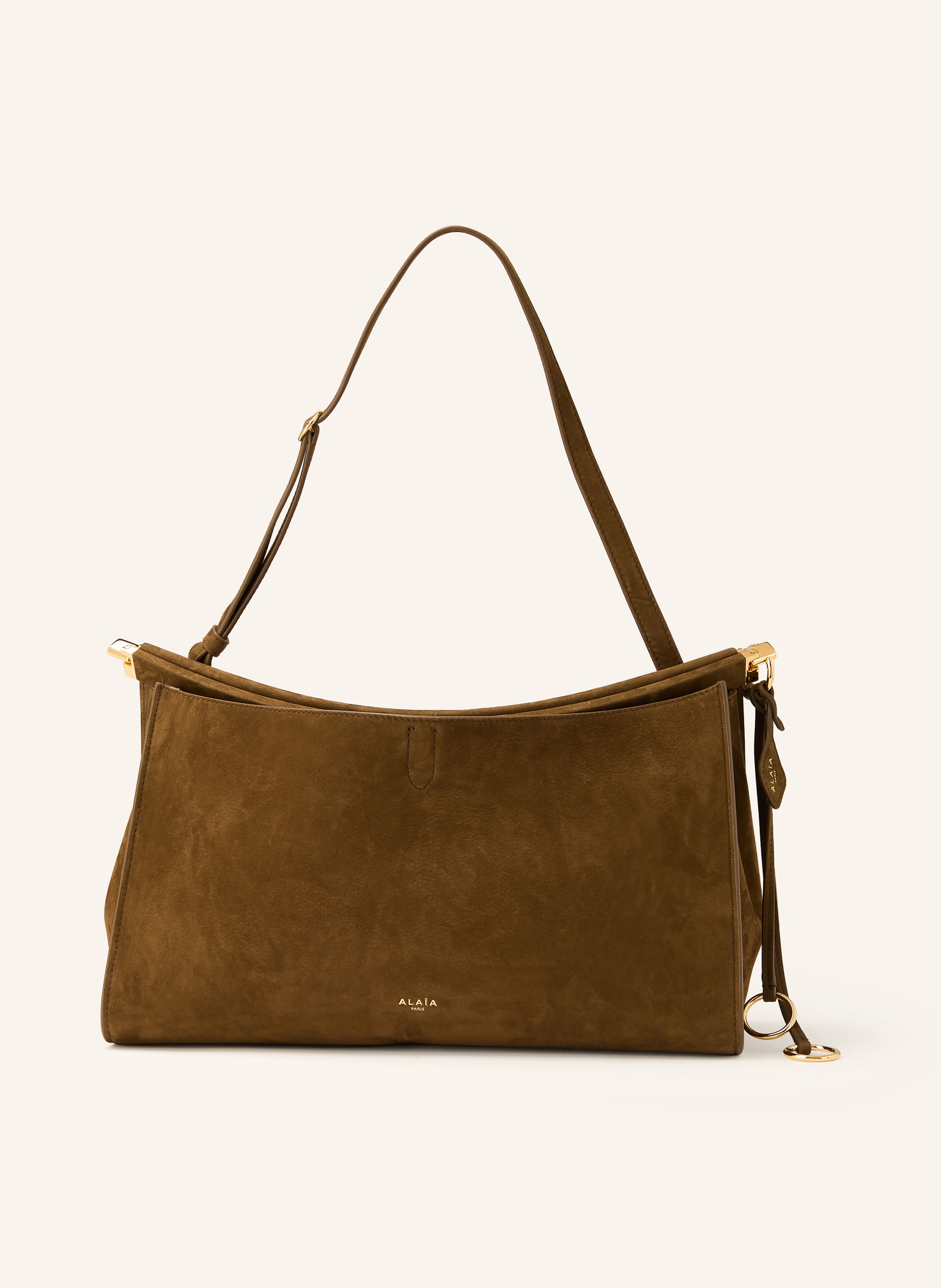Alaïa Fixierter Schulterriemen. Längenverstellbarer Schulterriemen. Verstärkter Taschenboden. Steckschließe. Innen ein Hauptfach. Label-Wording. Aus Veloursleder. Unifarben in braun / gold