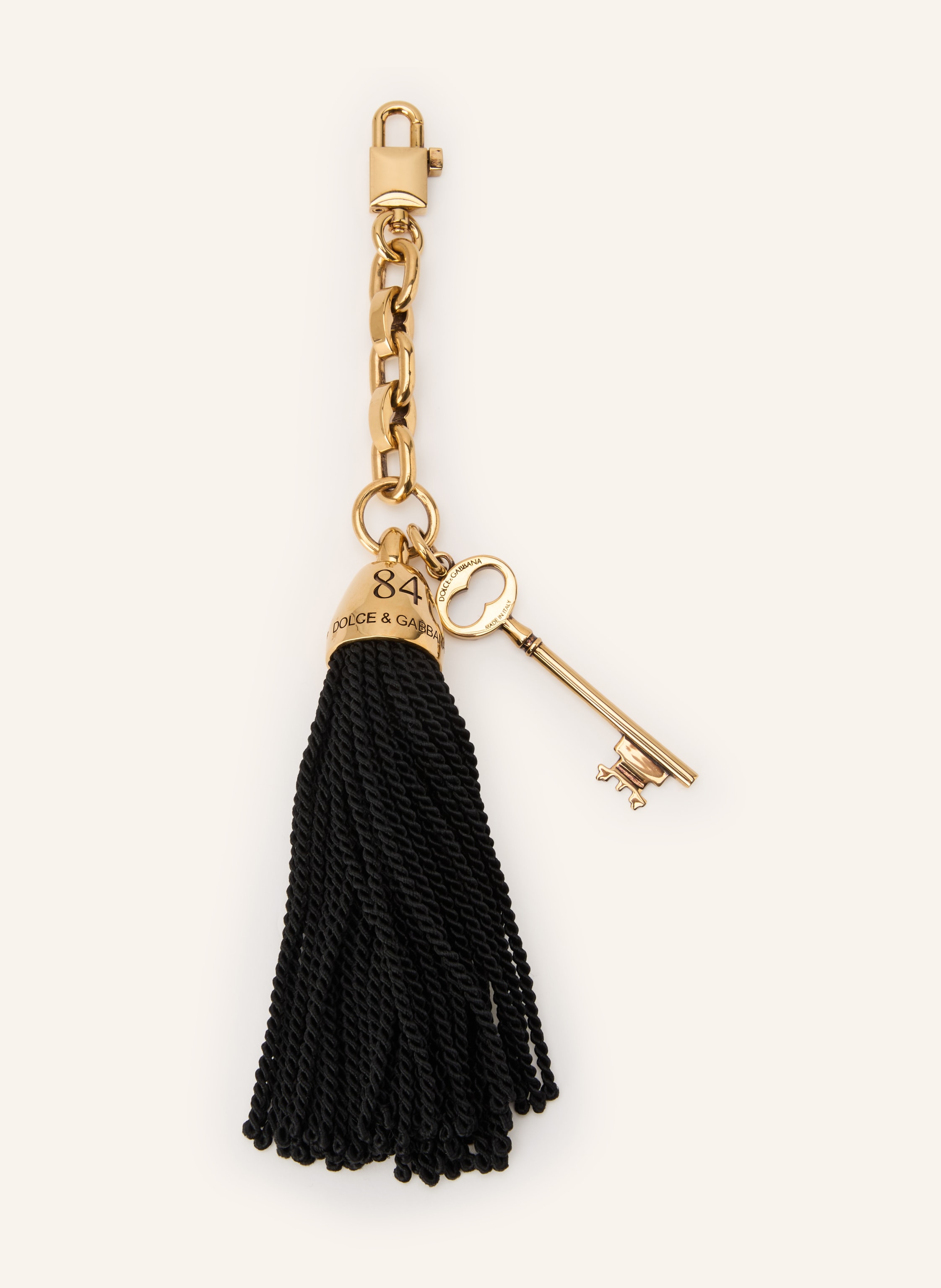 Dolce & Gabbana Karabiner. Messing. Textil. Goldfarbene Metalldetails. Unifarben. Made in Italy in schwarz / gold
