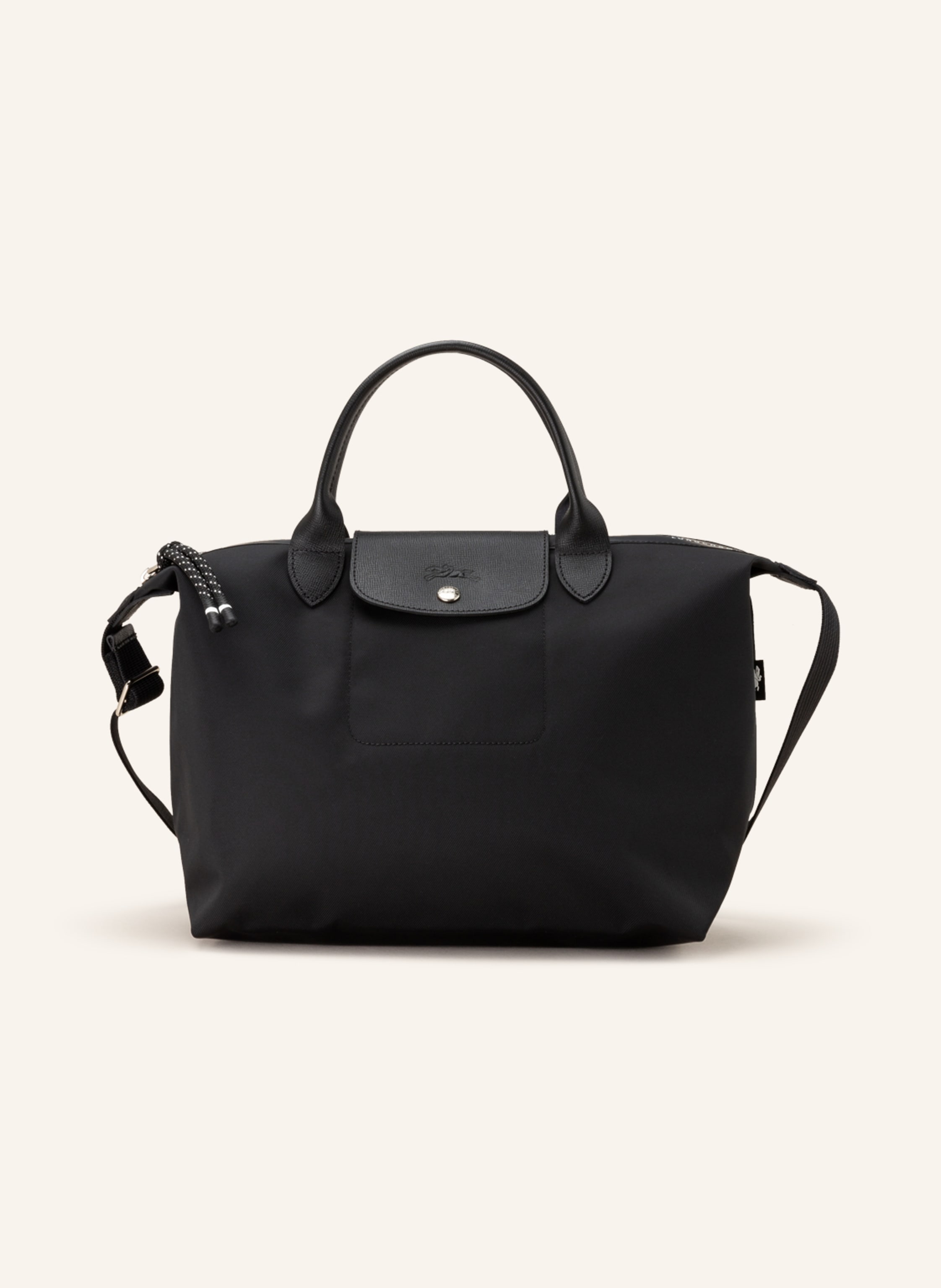 Longchamp Textil mit Lederdetails. Schließt mit Reißverschluss und Druckknopf. Längenverstellbarer Schulterriemen. Innen ein Hauptfach. Steckfach für Smartphone & Co. Label-Wording auf dem Reißverschluss. Logo- Medium in schwarz