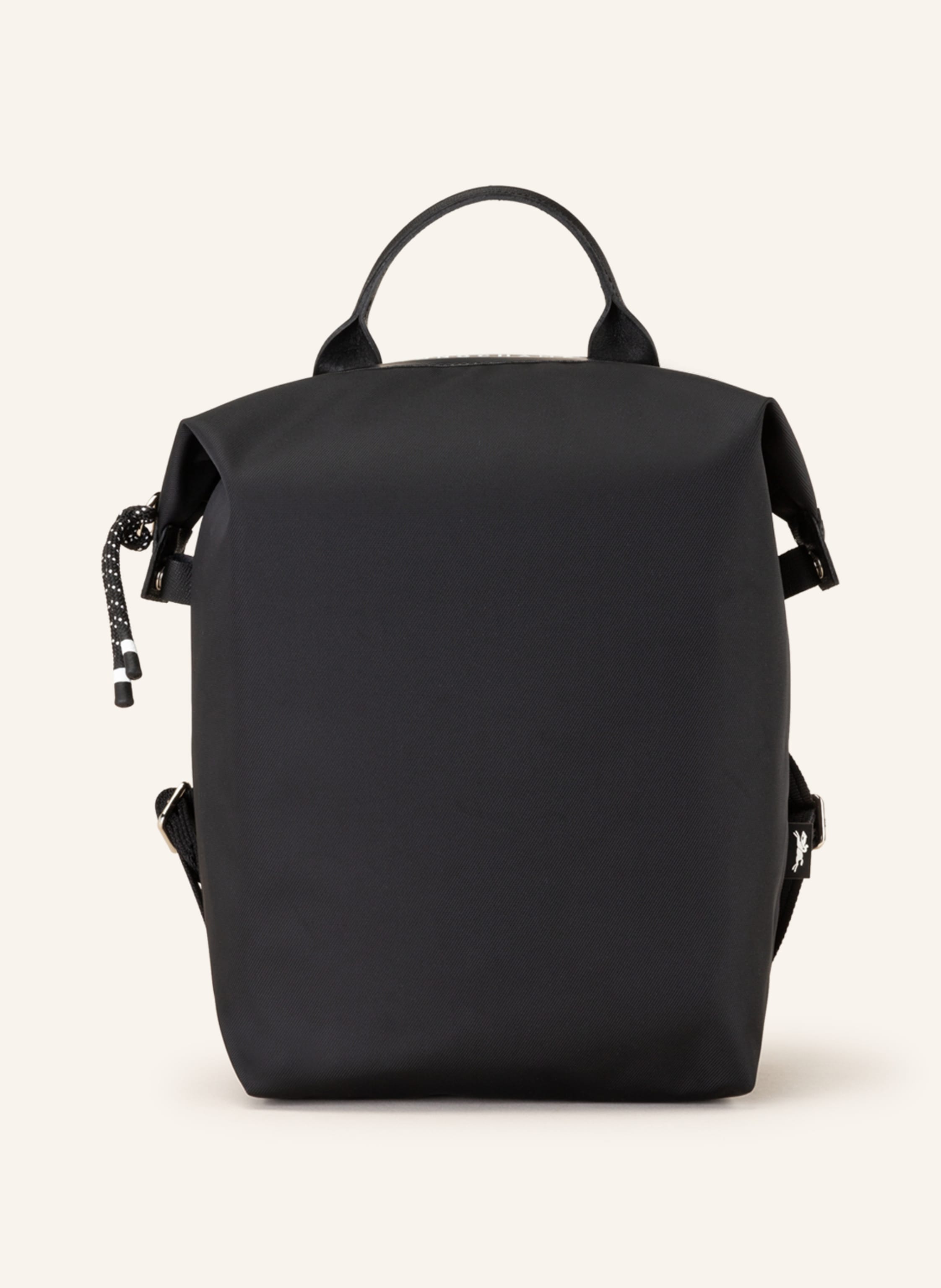 Longchamp Canvas. Silberfarbene Metalldetails. Tragegriff oben. Weitenverstellbare Schultergurte. Schließt mit Reißverschluss. Reißverschlussfach auf der Rückseite. Ein Hauptfach in schwarz