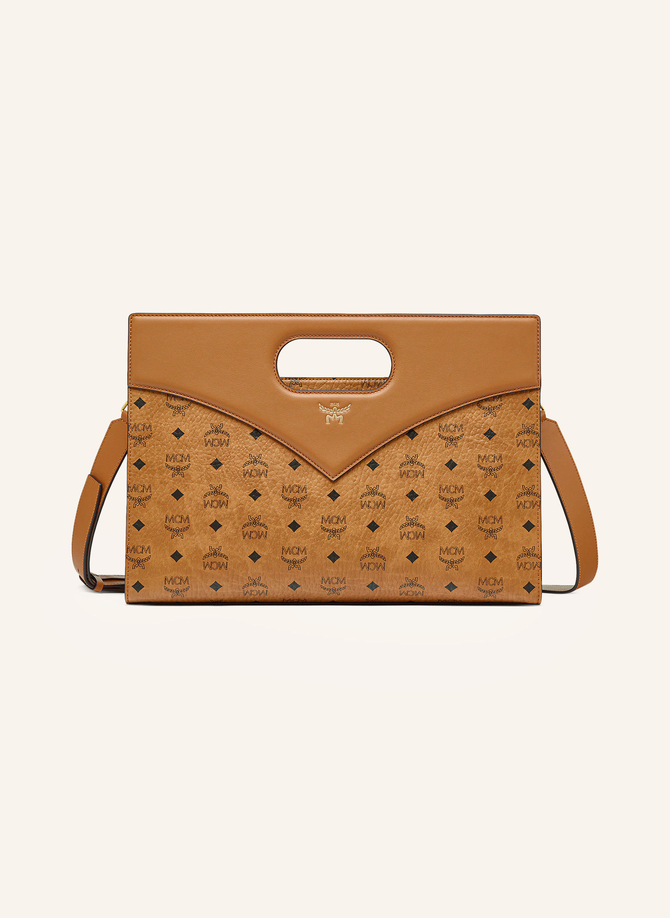 MCM Beschichtetes Canvas mit Lederdetails. Monogramm-Muster allover. Schließt mit Reißverschluss. Zwei Tragegriffe. Abnehmbarer, längenverstellbarer Schulterriemen. Innen ein Hauptfach. Innenfach mit Reiß in cognac