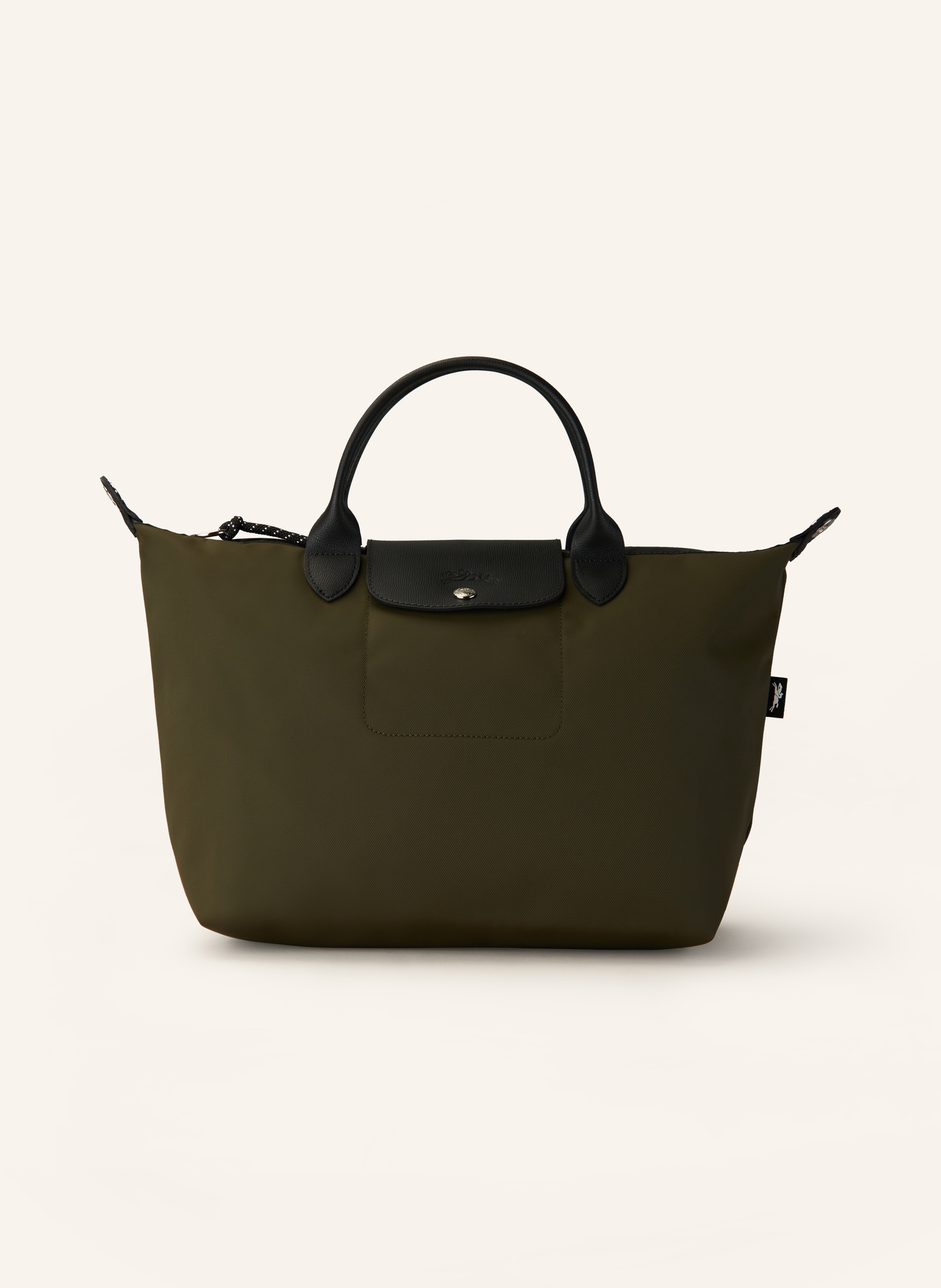 Longchamp Textil mit Lederdetails. Schließt mit Reißverschluss und Druckknopf. Längenverstellbarer Schulterriemen. Innen ein Hauptfach. Steckfach für Smartphone & Co. Label-Wording auf dem Reißverschluss. Logo- Medium in khaki