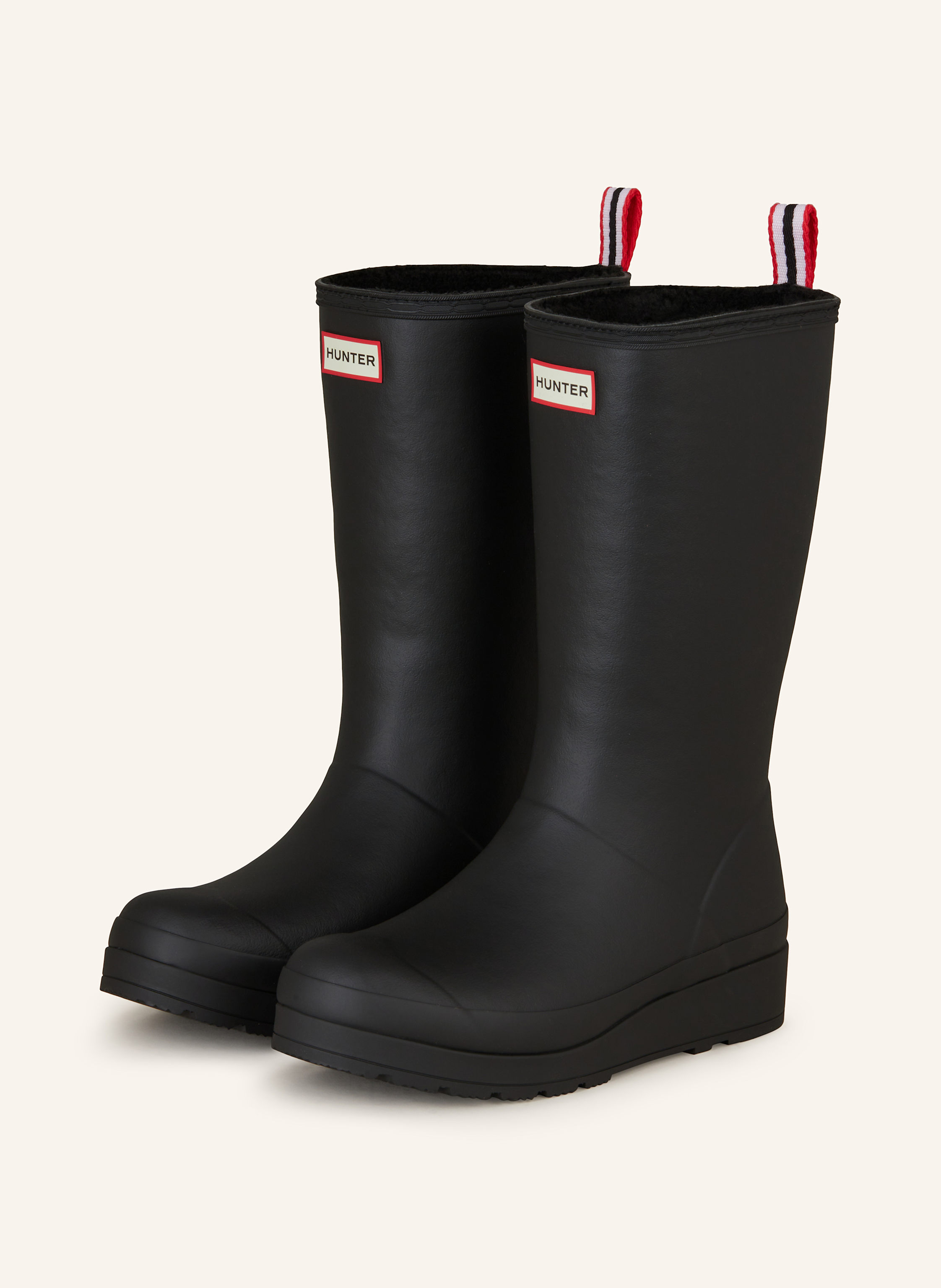 Tall black rubber boots top
