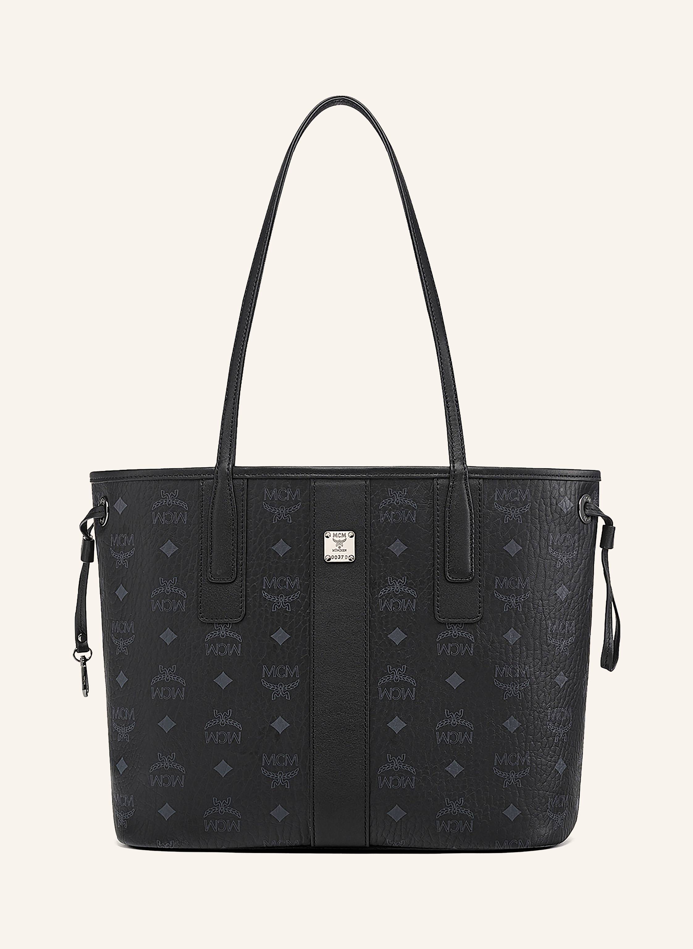 MCM Zum Wenden. Beschichtetes Canvas mit Lederdetails. Monogramm-Muster allover. Zwei Tragegriffe. Herausnehmbare Pouch. Innen ein Hauptfach. Verstärkter Taschenboden. Label-Plakette auf der Front Small in schwarz