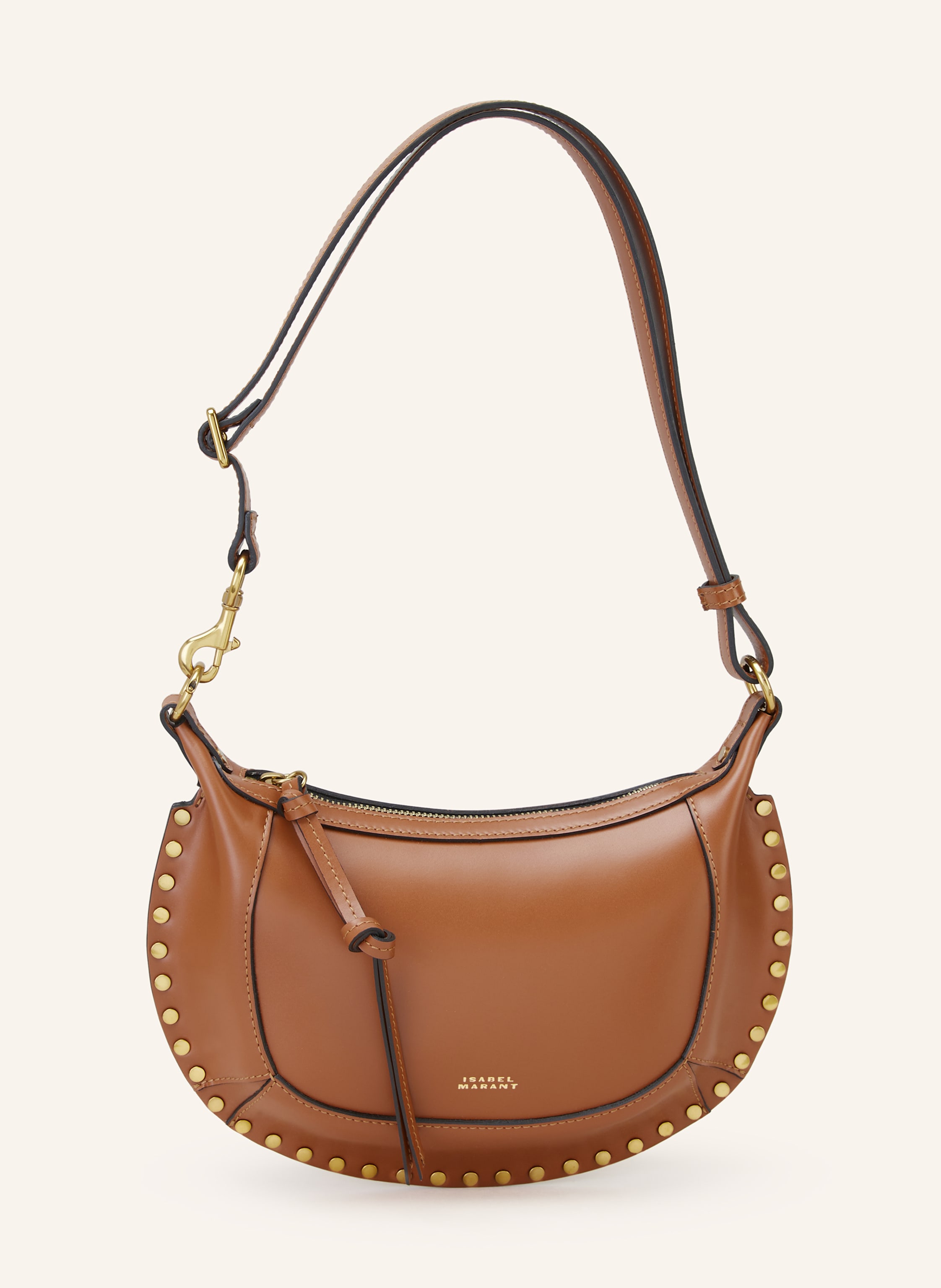 Isabel Marant Glattleder. Schließt mit Reißverschluss. Abnehmbarer, längenverstellbarer Schulterriemen. Innen ein Hauptfach. Ein Steckfach. Verstärkter Taschenboden. Made in Italy in cognac