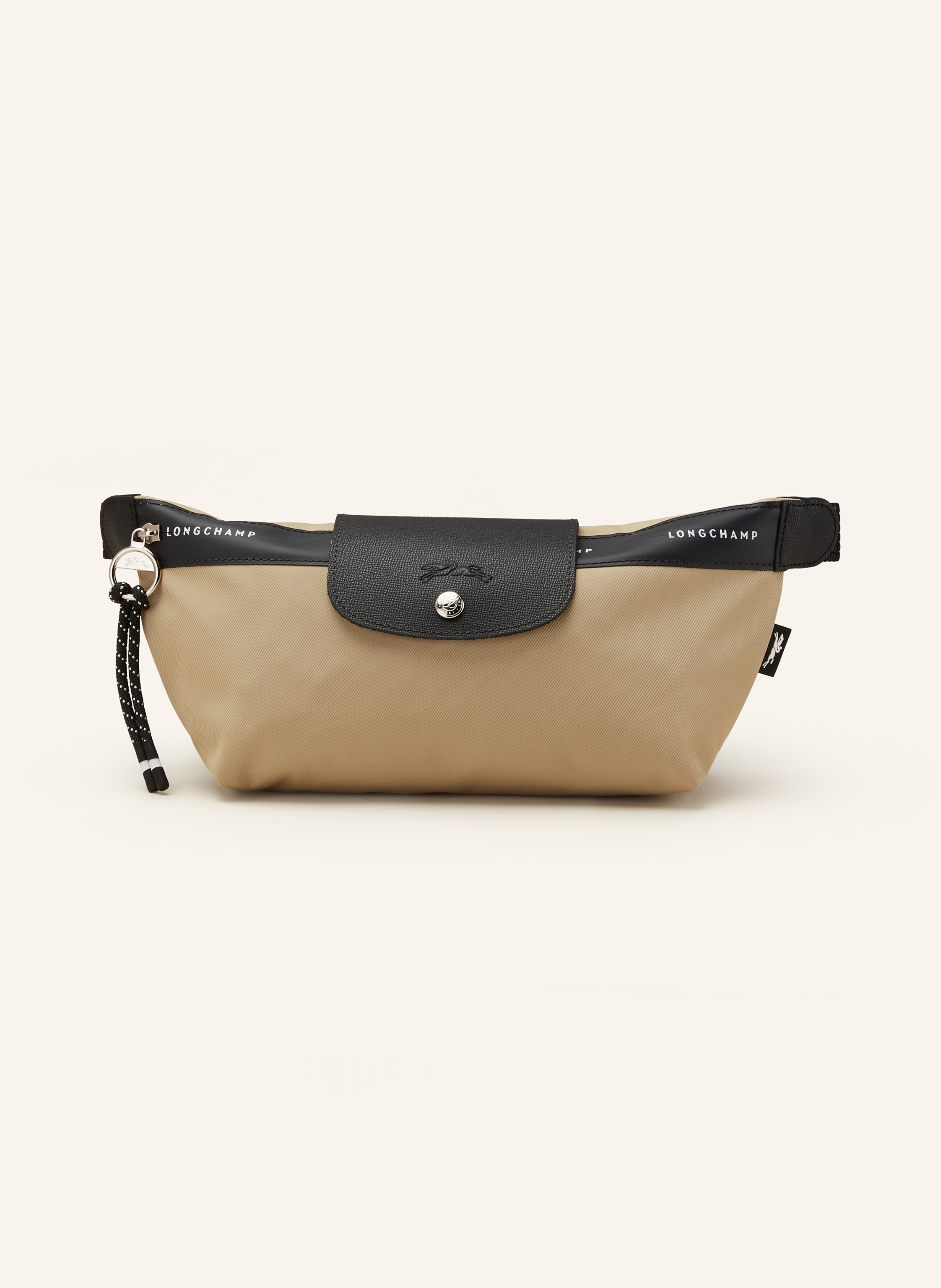 Longchamp Fein genarbtes Leder und Textil. Schließt mit Druckknopf und Reißverschluss. Längenverstellbarer Schulterriemen mit Steckschließe. Innen ein Hauptfach. Ein Steckfach für Smartphone & Co. Twill-Struktu in beige / schwarz