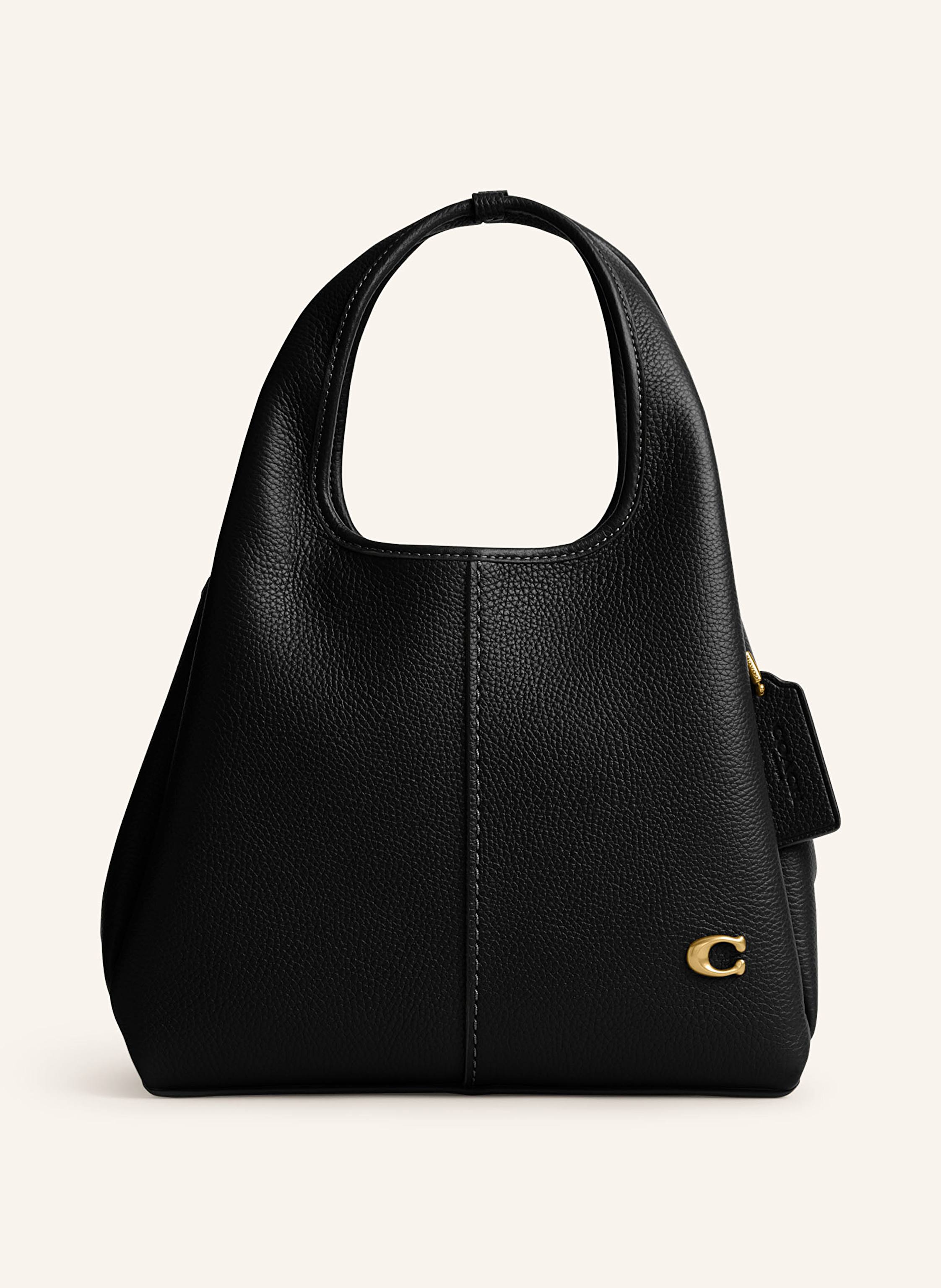 Coach Ein Steckfach. Innen zwei Hauptfächer. Abnehmbarer Schulterriemen. Längenverstellbarer Schulterriemen. Zwei Tragegriffe. Verstärkter Taschenboden. Label-Detail. Genarbtes Leder. Unifarben in schwarz