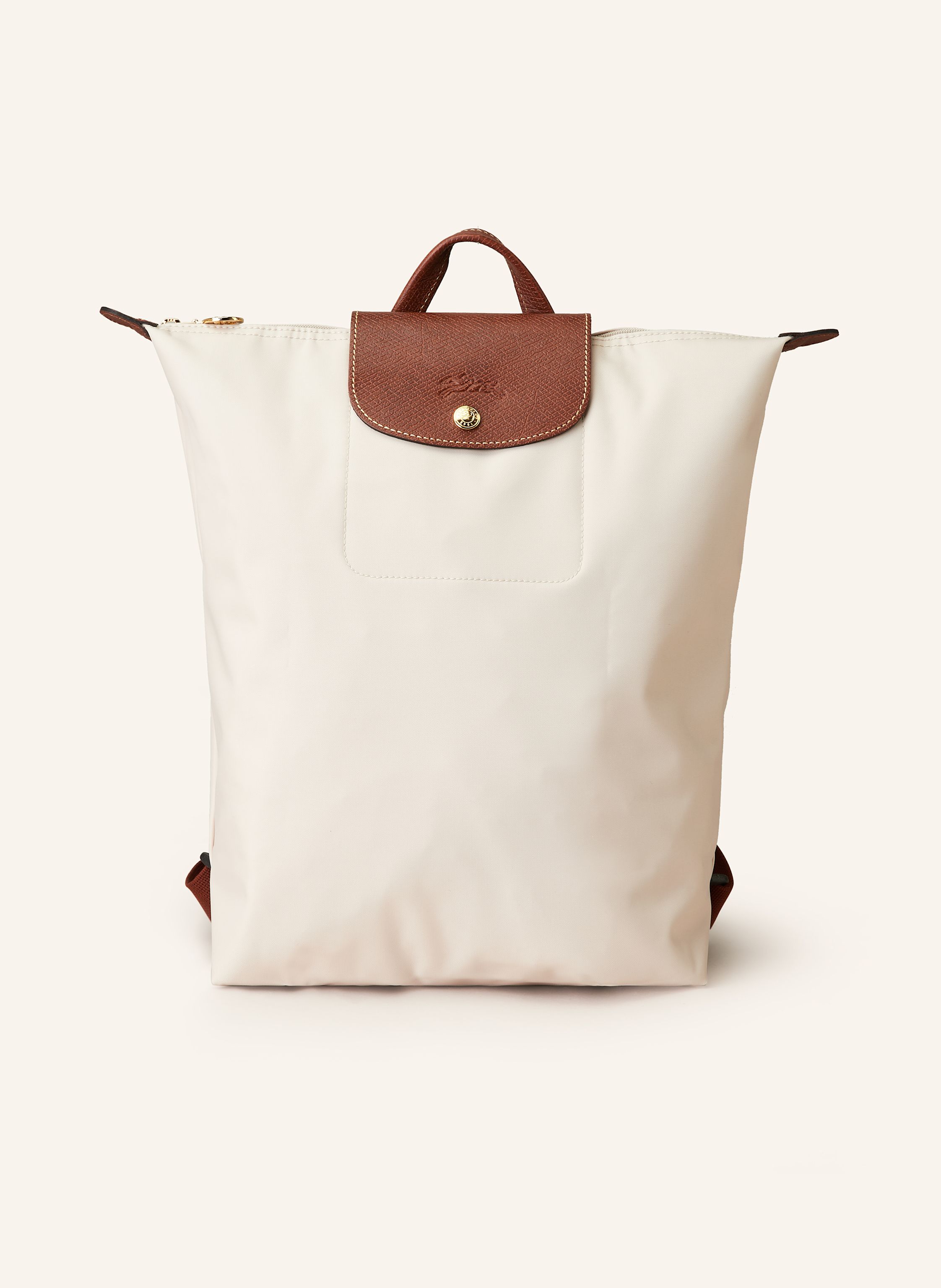Longchamp Synthetische Verarbeitung mit Lederdetails. Goldfarbene Metalldetails. Schließt mit einem Reißverschluss und Druckknopf. Längenverstellbarer Schulterriemen. Handgriff. Logo-Prägung am Überschlag. Dank Medium in nude / braun