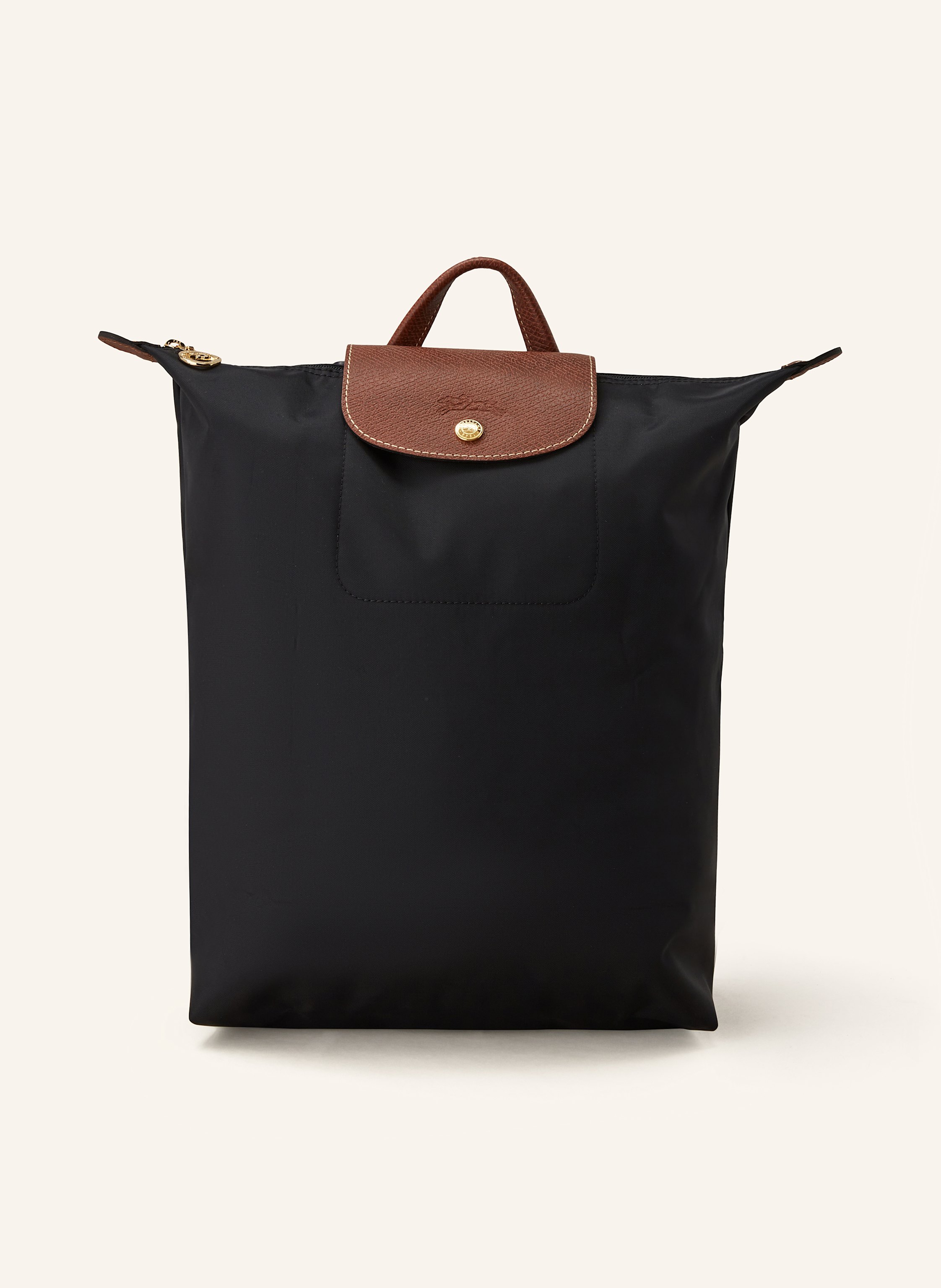 Longchamp Synthetische Verarbeitung mit Lederdetails. Goldfarbene Metalldetails. Schließt mit einem Reißverschluss und Druckknopf. Längenverstellbarer Schulterriemen. Handgriff. Logo-Prägung am Überschlag. Dank Medium in schwarz / cognac