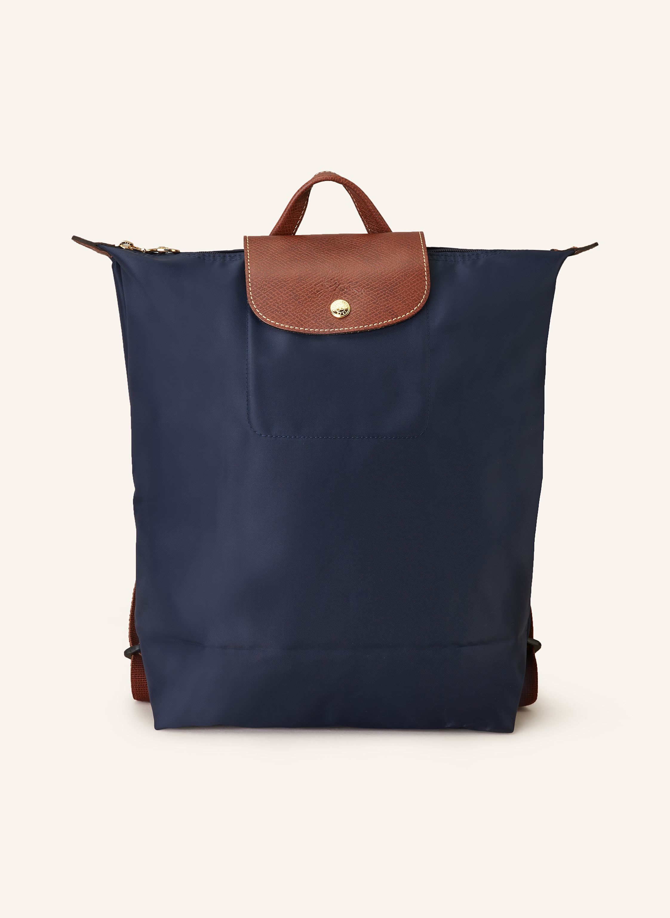 Longchamp Synthetische Verarbeitung mit Lederdetails. Goldfarbene Metalldetails. Schließt mit einem Reißverschluss und Druckknopf. Längenverstellbarer Schulterriemen. Handgriff. Logo-Prägung am Überschlag. Dank Medium in dunkelblau