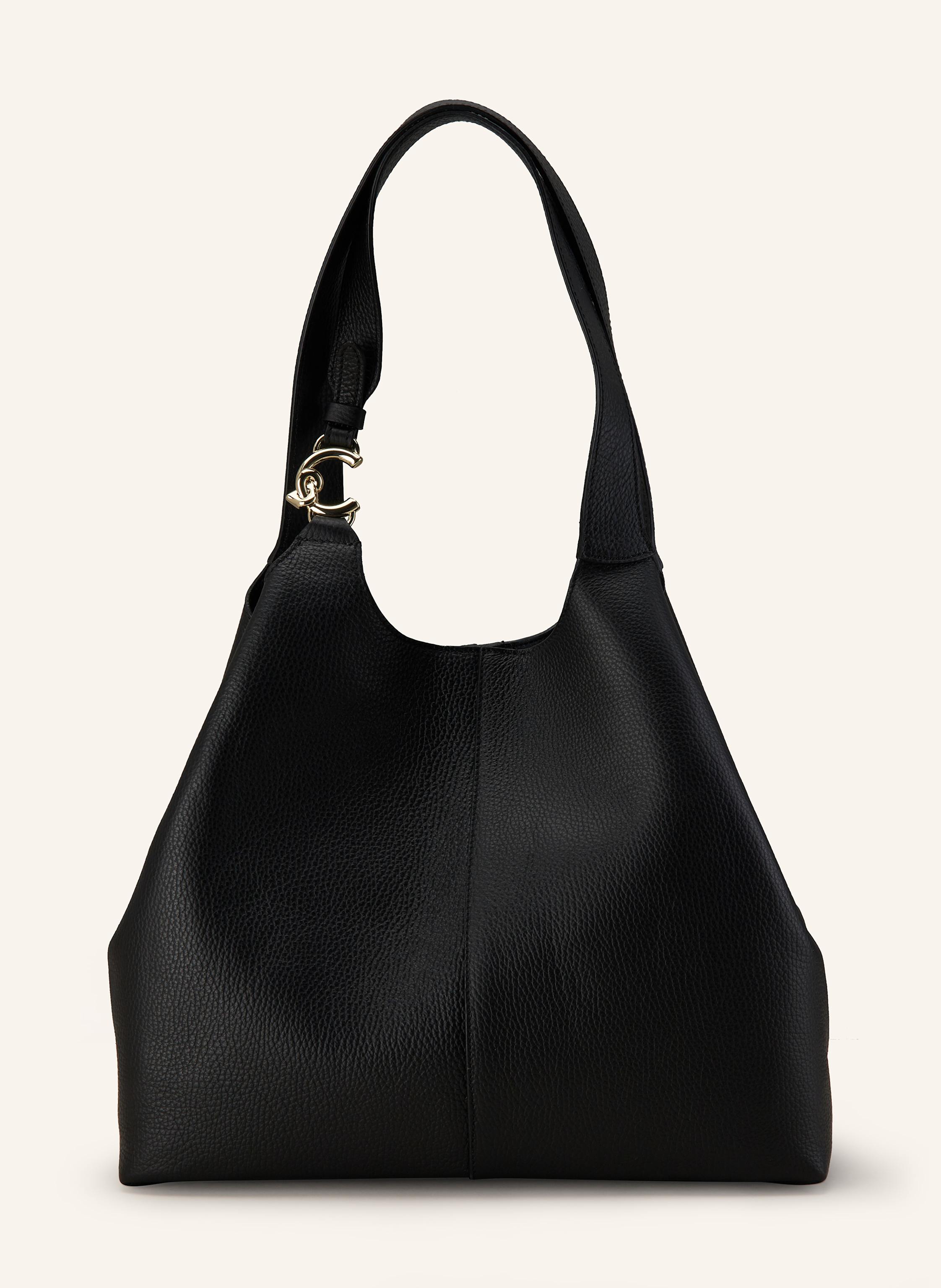 Coccinelle Genarbtes Leder. Schließt mit Druckknopf und Steckschließe innen. Zwei Schulterriemen. Herausnehmbare Pouch. Innen ein Hauptfach. Verstärkter Taschenboden. Label-Monogramm am Schulterriemen in schwarz