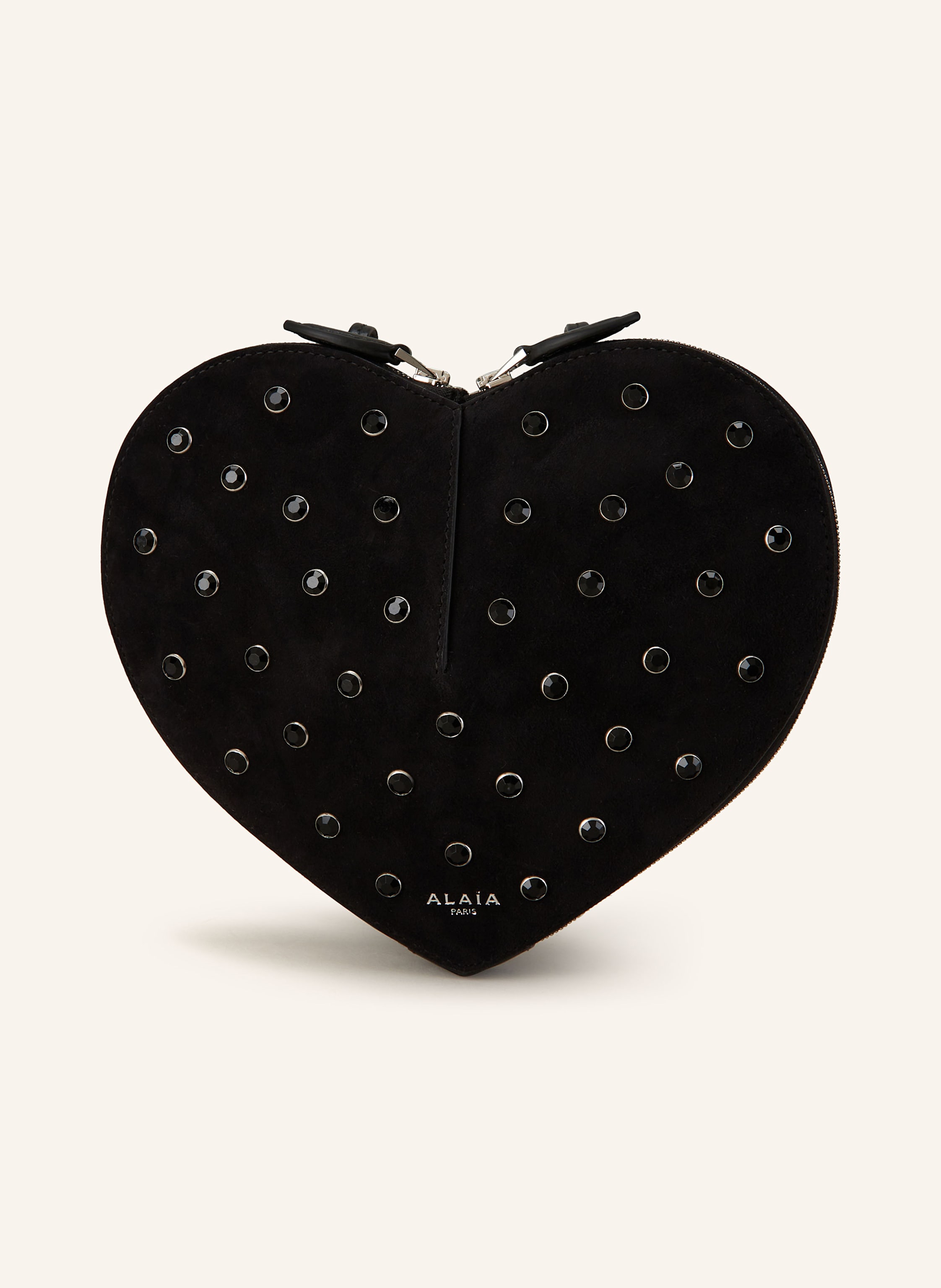 Alaïa Nubukleder. Labeltypisches herzförmiges Design. Schließt mit Zwei-Wege-Reißverschluss. Längenverstellbarer Schulterriemen. Verstärkter Taschenboden. Label-Detail auf der Front. Schmucksteinbesatz allo in schwarz
