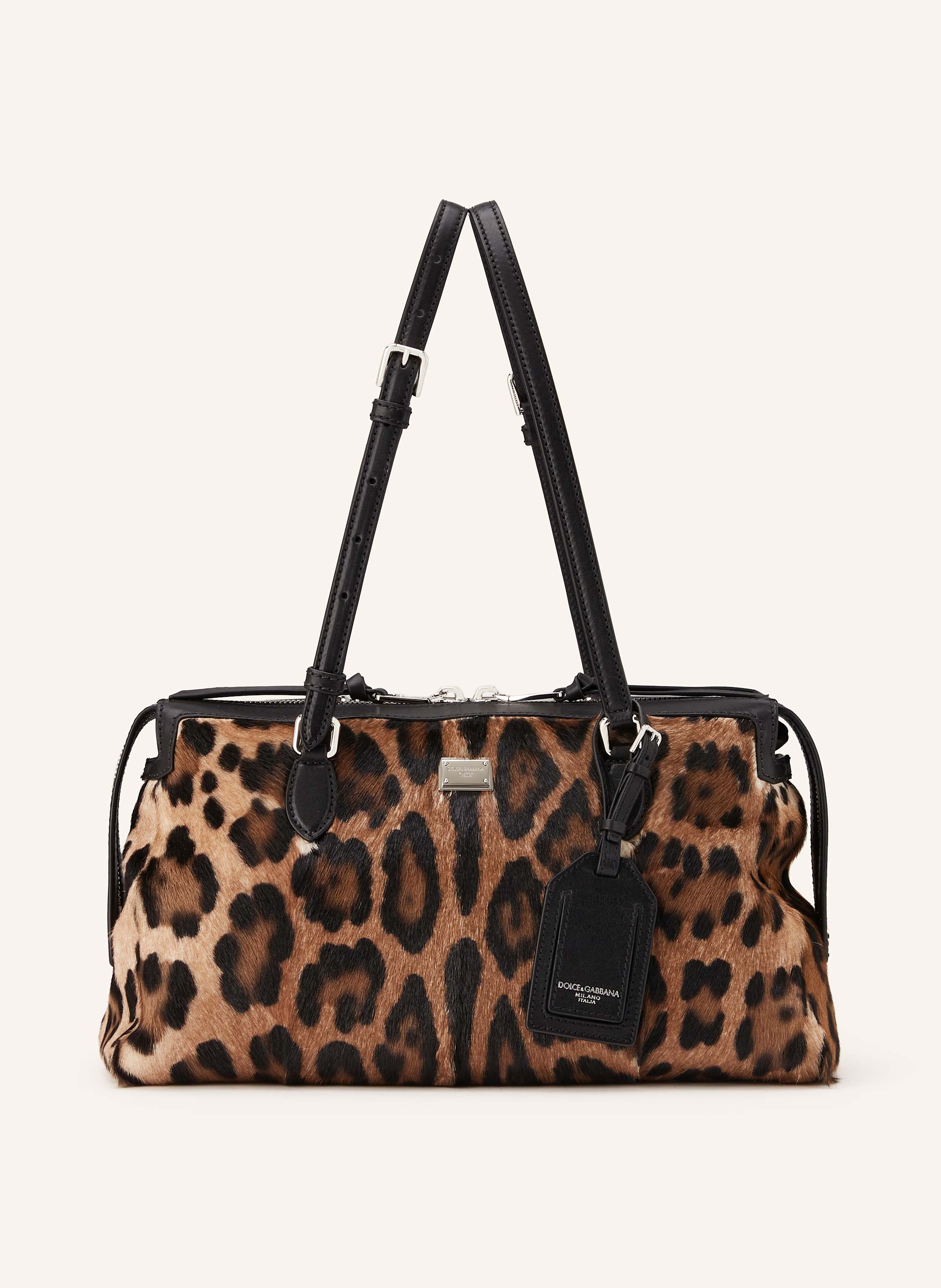 Dolce & Gabbana Leder mit Struktur. Ponyfell-Optik. Animal-Muster. Schließt mit Reißverschluss. Tragegriff. Längenverstellbarer Schulterriemen. Innen ein Hauptfach. Innenfach mit Reißverschluss. Steckfach für Smartph in schwarz / hellbraun