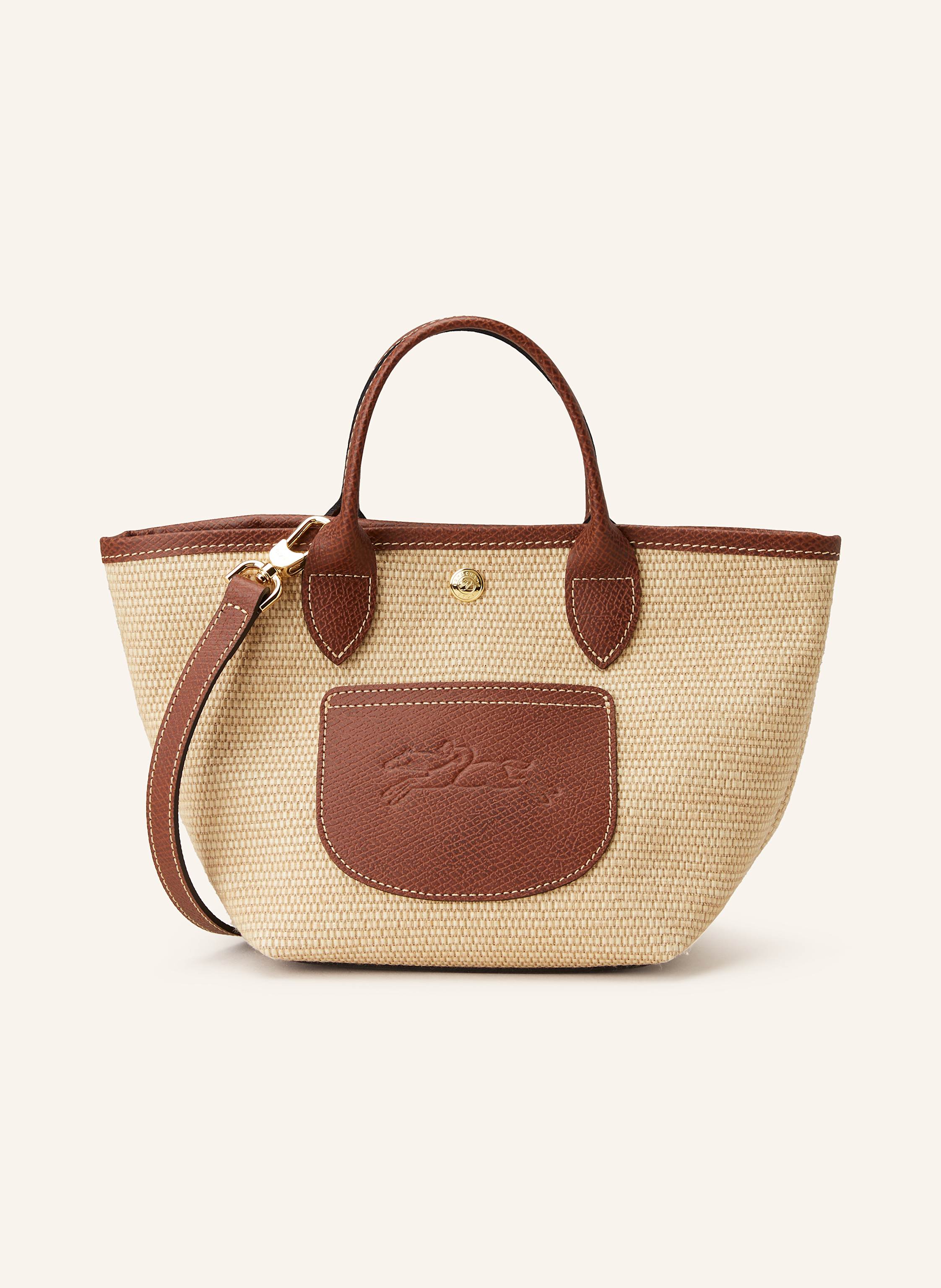Longchamp Canvas mit Lederdetails. Leder mit Struktur. Schließt mit Druckknopf. Zwei Tragegriffe. Außenfach auf der Vorderseite. Innenfach mit Reißverschluss. Verstärkter Taschenboden. Abnehmbarer Label-Anhänge Small in beige / braun