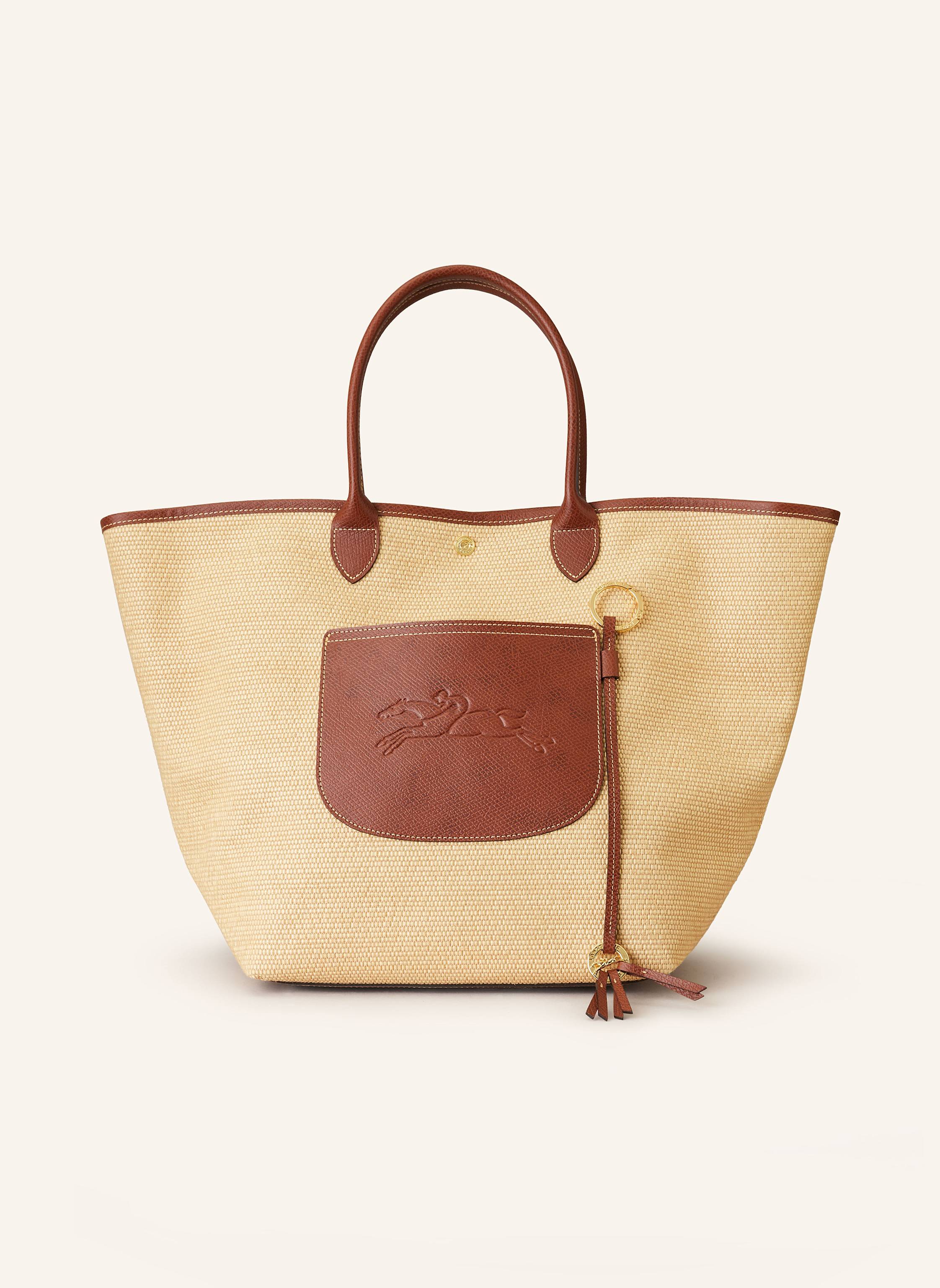 Longchamp Canvas mit Lederdetails. Leder mit Struktur. Schließt mit Druckknopf. Zwei Tragegriffe. Außenfach auf der Vorderseite. Innenfach mit Reißverschluss. Verstärkter Taschenboden. Abnehmbarer Label-Anhänge Large in beige / braun
