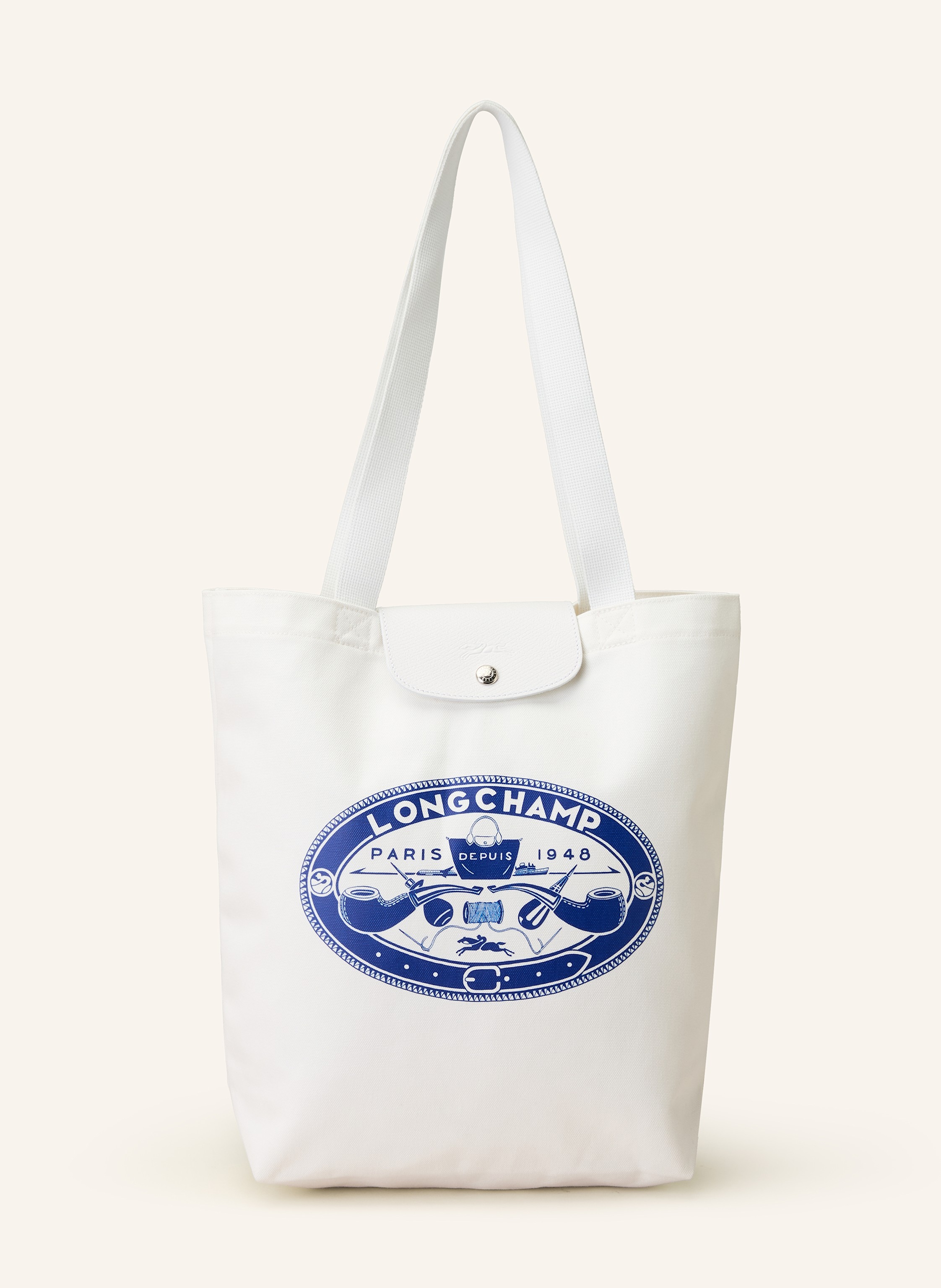 Longchamp Textil mit Lederdetails. Schließt mit Druckknopf. Zwei Tragegriffe. Innen ein Hauptfach. Ein Steckfach für Smartphone & Co. Label-Print auf der Front Medium in weiss