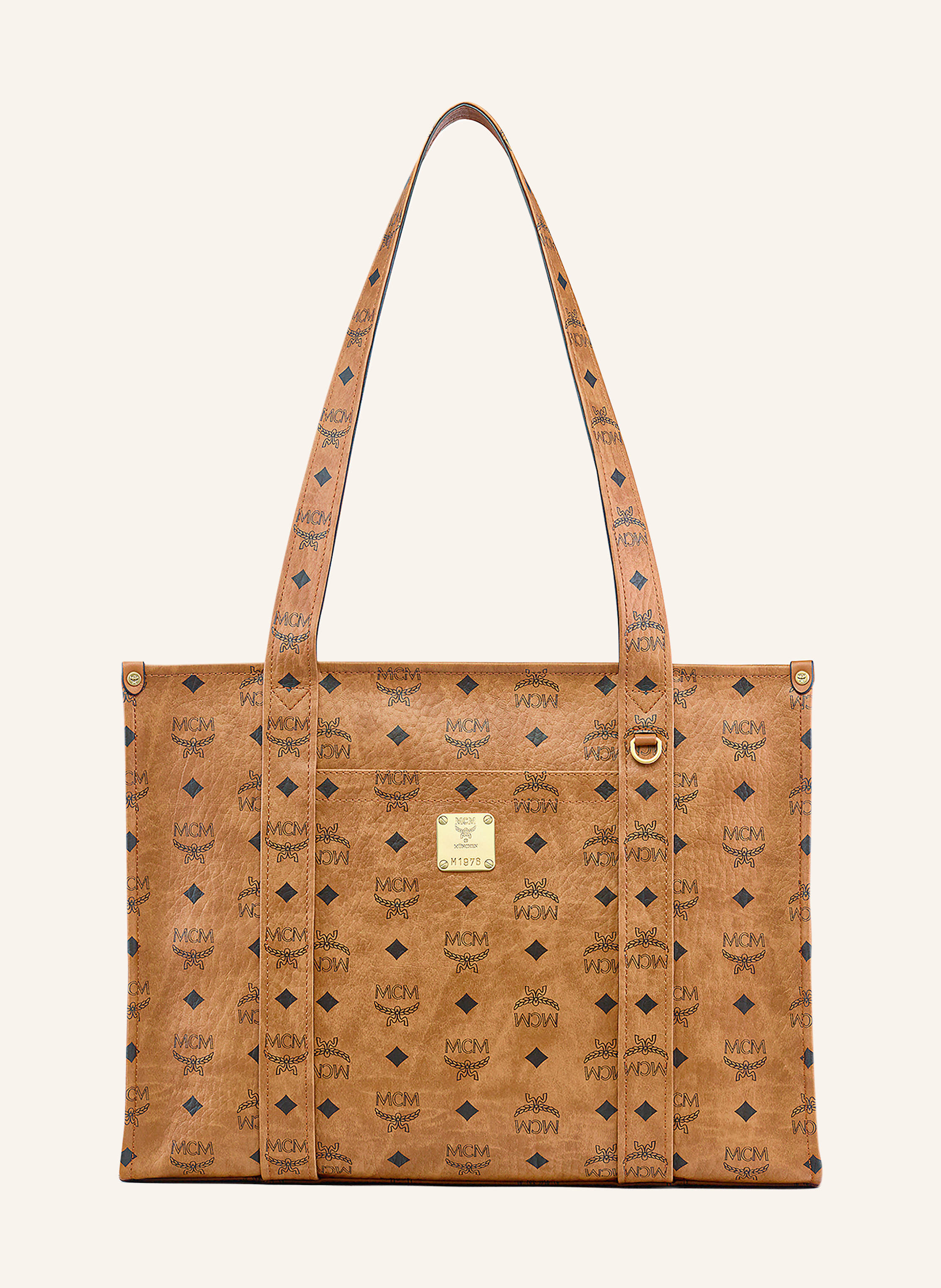 MCM Beschichtetes Canvas. Schließt mit Reißverschluss. Ein Tragegriff. Innen ein Hauptfach. Steckfach für Smartphone & Co. Verstärkter Taschenboden. Label-Plakette auf der Front. Label-Details allover in cognac / schwarz