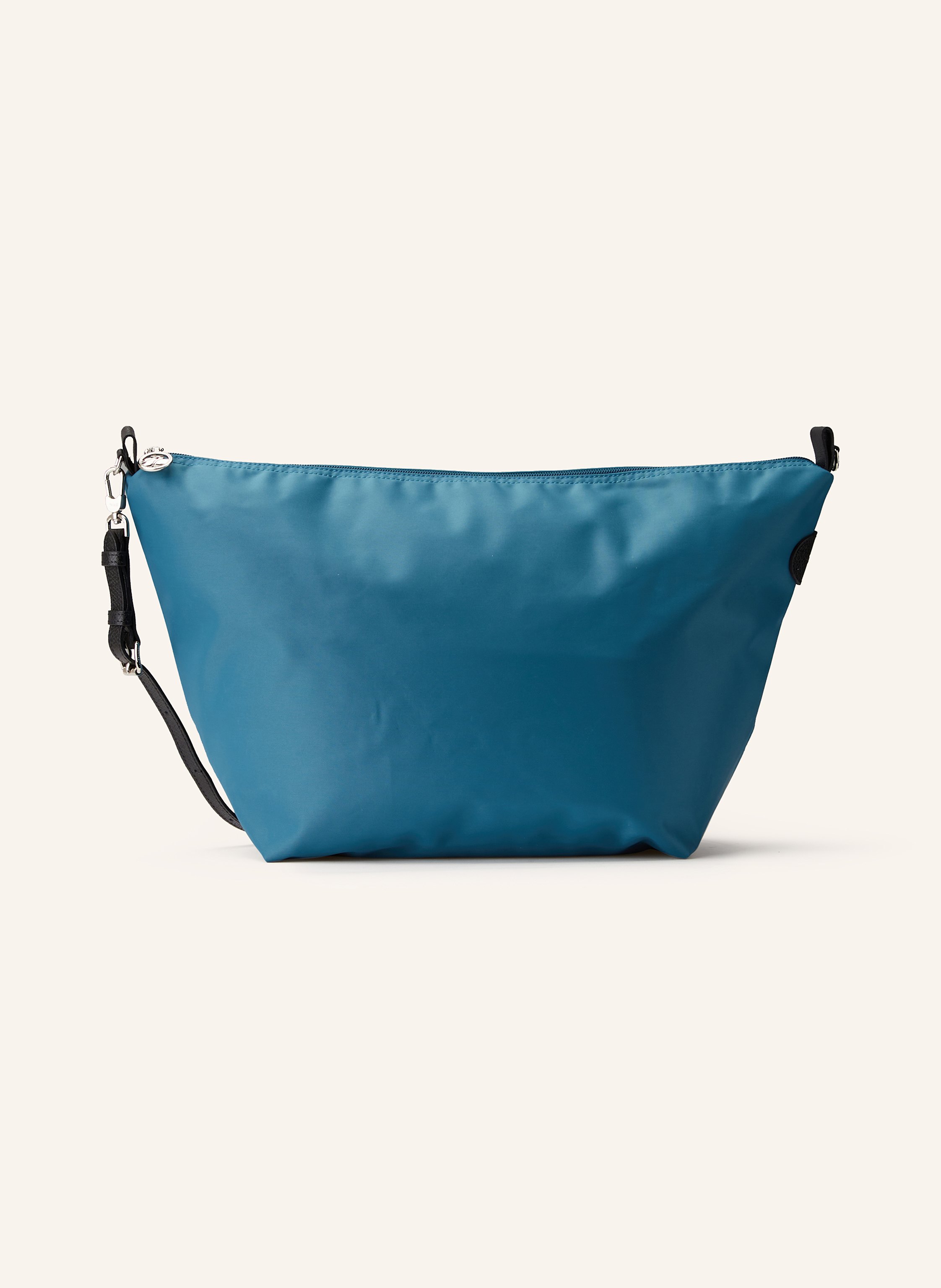 Longchamp Textil. Schließt mit Reißverschluss. Abnehmbarer, längenverstellbarer Schulterriemen. Innen ein Hauptfach. Innenfach mit Reißverschluss. Ein Steckfach in petrol