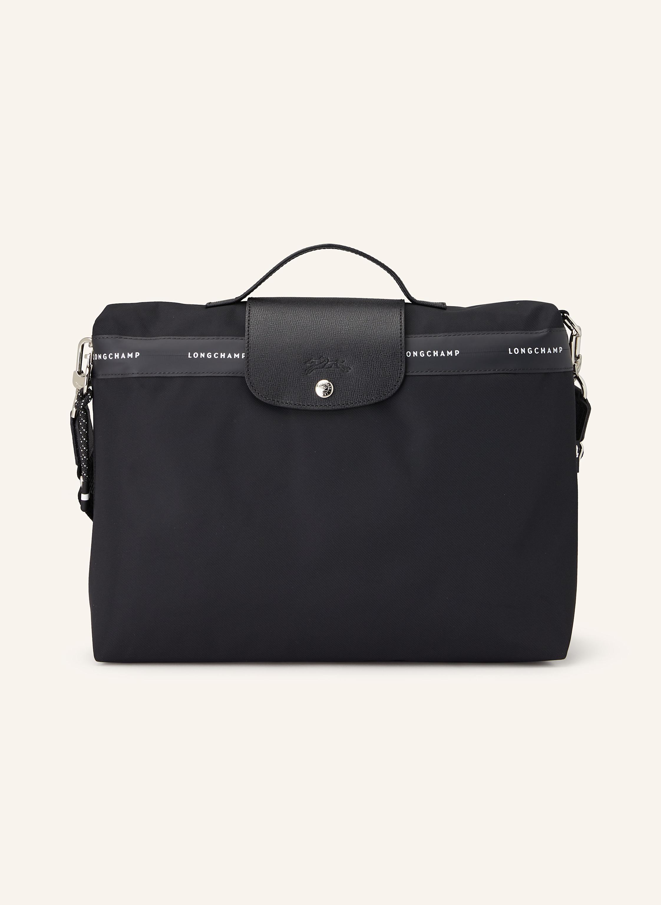 Longchamp Textil, Synthetik und genarbtes Leder. Ein Tragegriff oben. Längenverstellbarer, abnehmbarer Schulterriemen. Schließt mit Reißverschluss und Druckknopf. Ein Hauptfach. Laptop-Fach. Reißverschlussfach in schwarz