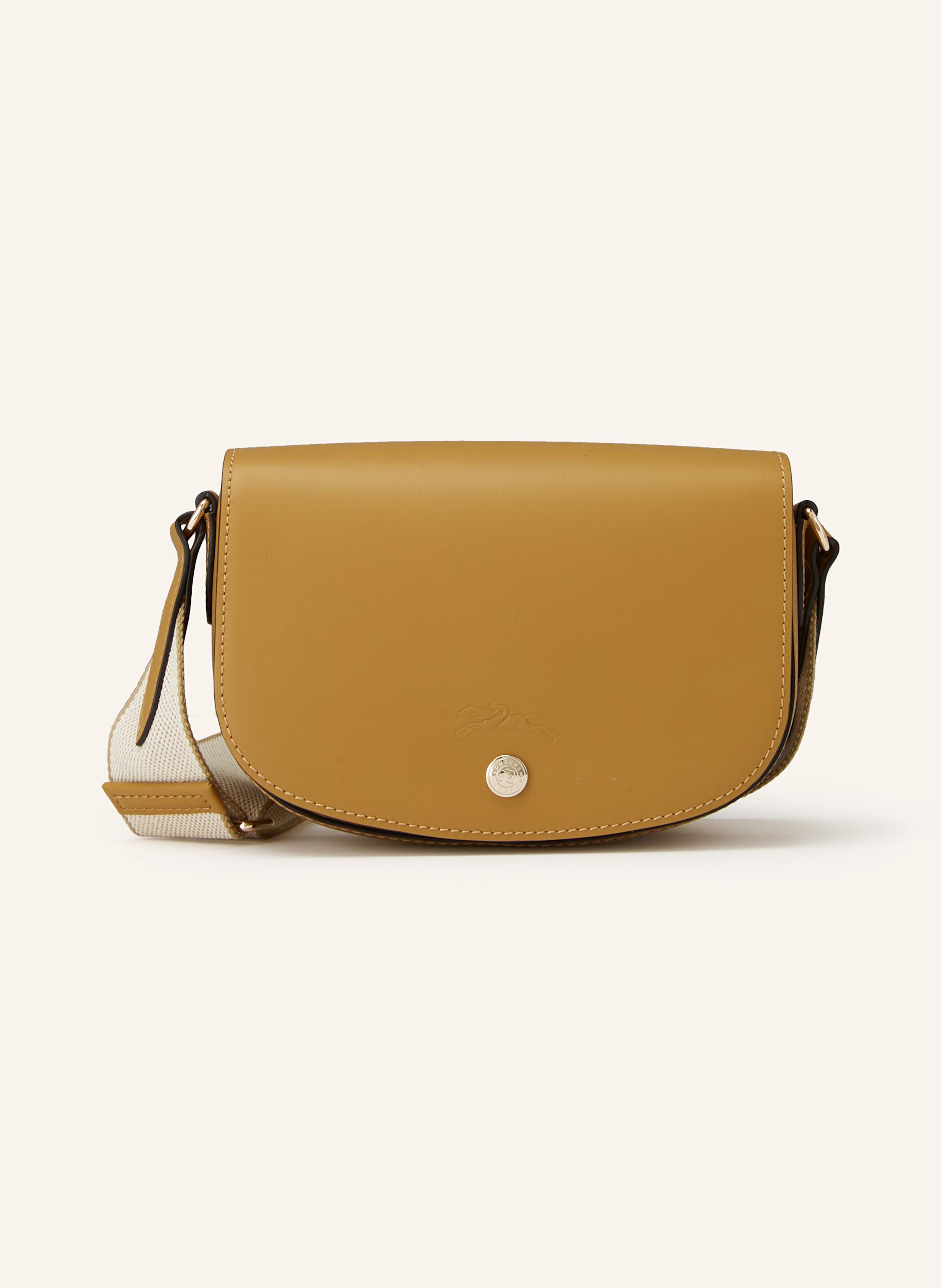 Longchamp Glattleder. Schließt mit Druckknopf. Längenverstellbarer Schulterriemen. Innen ein Hauptfach. Ein Steckfach. Logo-Prägung auf der Front Small in hellbraun