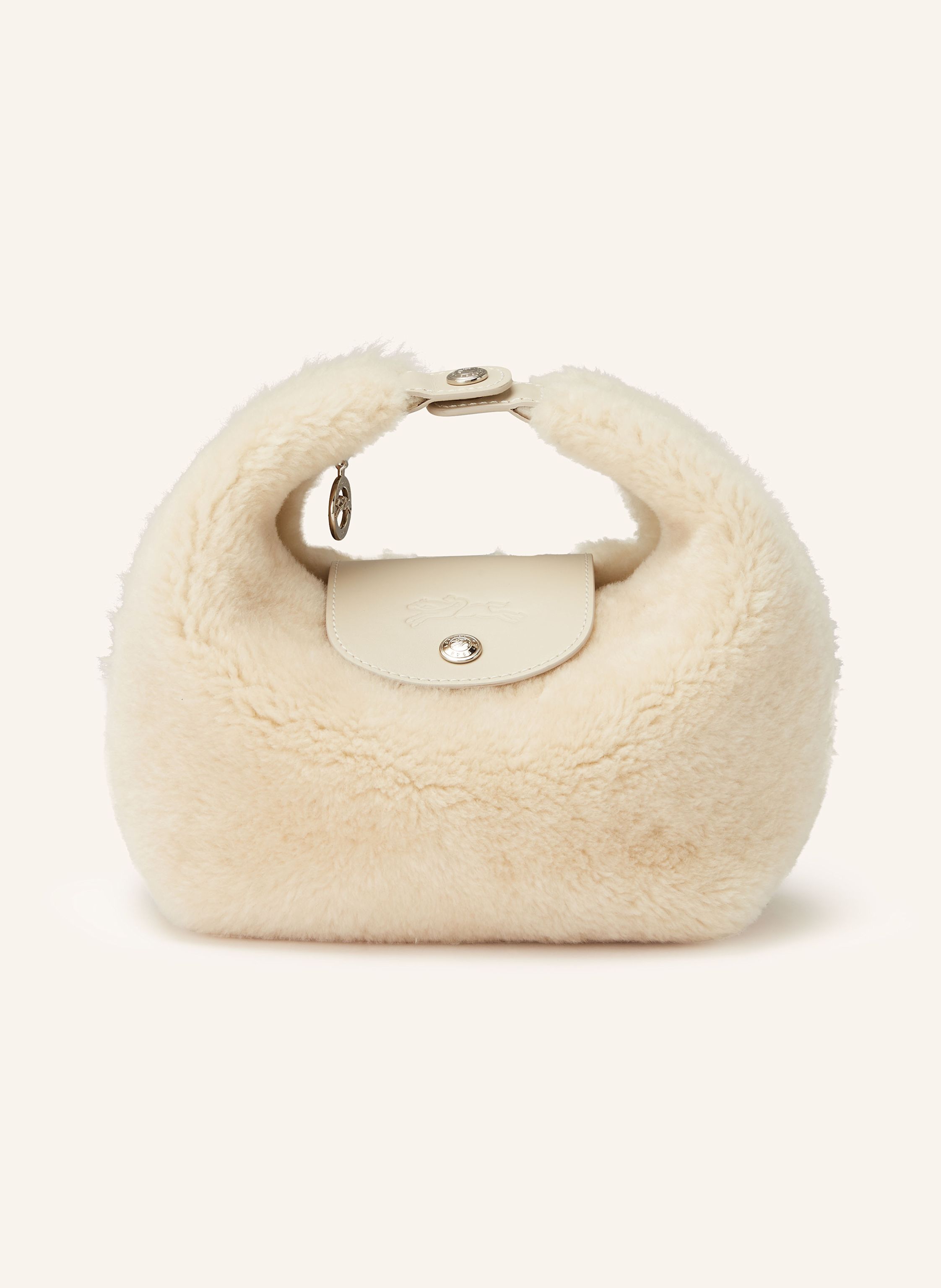 Longchamp Glattleder und Wolle. Schließt mit Druckknopf. Ein Tragegriff. Innen ein Hauptfach. Steckfach. Label-Details in ecru