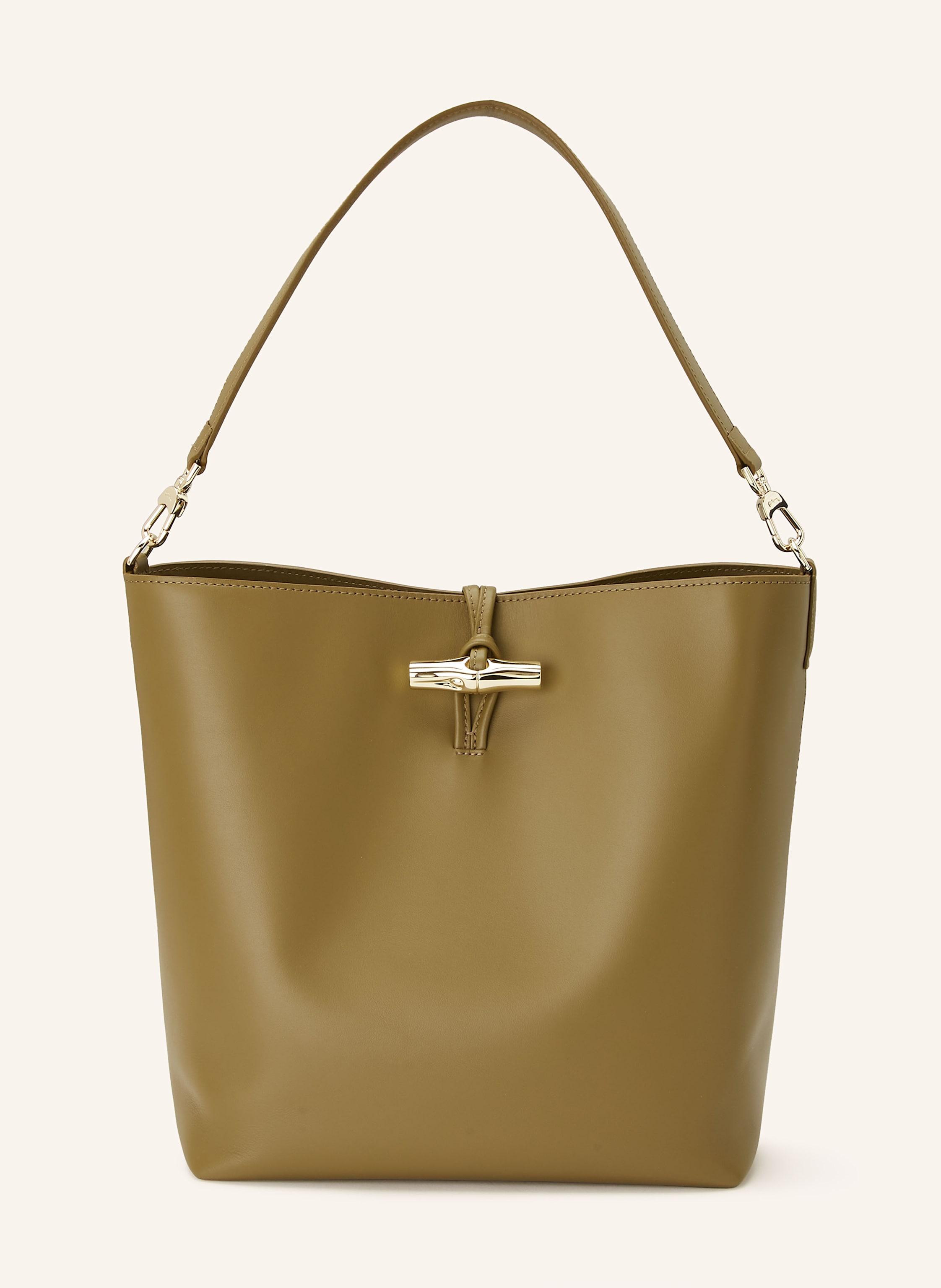 Longchamp Glattleder. Schließt mit Hakenverschluss. Abnehmbarer Schulterriemen. Innen ein Hauptfach. Innenfach mit Reißverschluss. Ein Steckfach. Ein Kartenfach. Verstärkter Taschenboden Medium in oliv