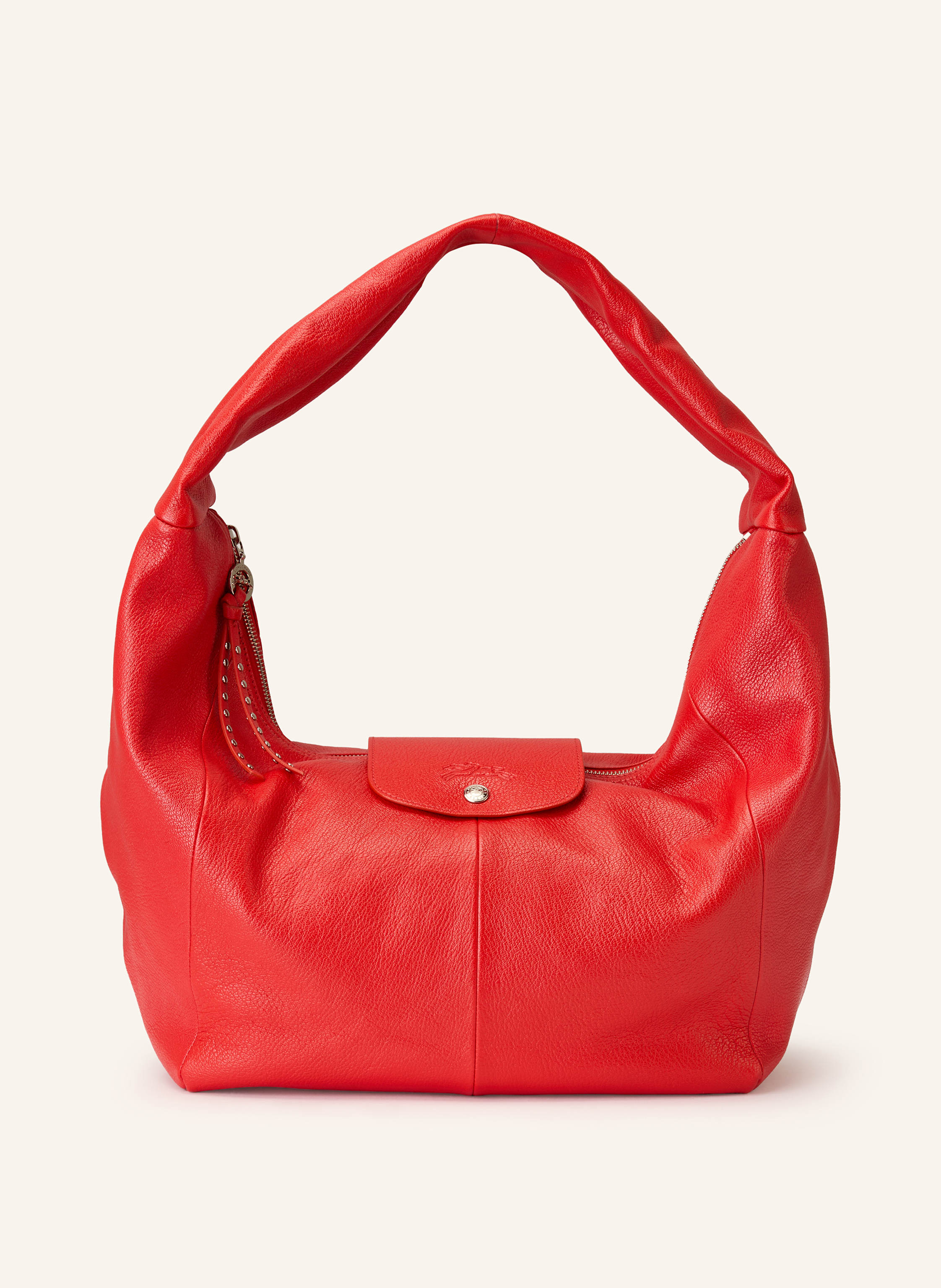 Longchamp Genarbtes Leder. Schließt mit Reißverschluss und Druckknopf. Schulterriemen. Innen ein Hauptfach. Innenfach mit Reißverschluss. Ein Steckfach. Label-Prägung auf dem Überschlag Large in rot