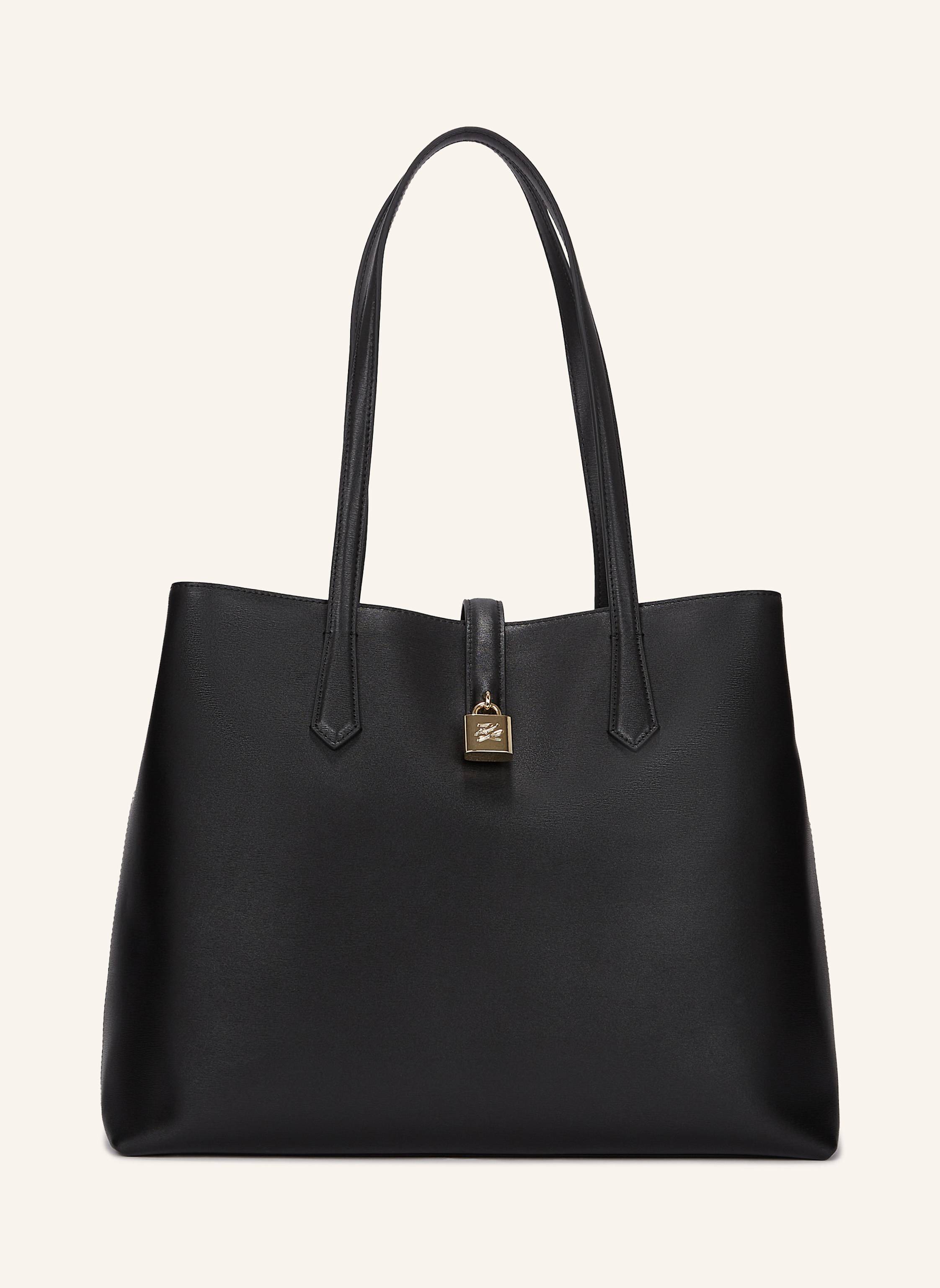 Karl Lagerfeld Diese elegante Tote-Bag ist aus hochwertigem Leder gefertigt und strahlt Eleganz sowie Stilsicherheit aus. Sie verfügt über ein innenliegendes Reißverschlussfach für erhöhte Sicherheit sowie einen mag in schwarz/ gold