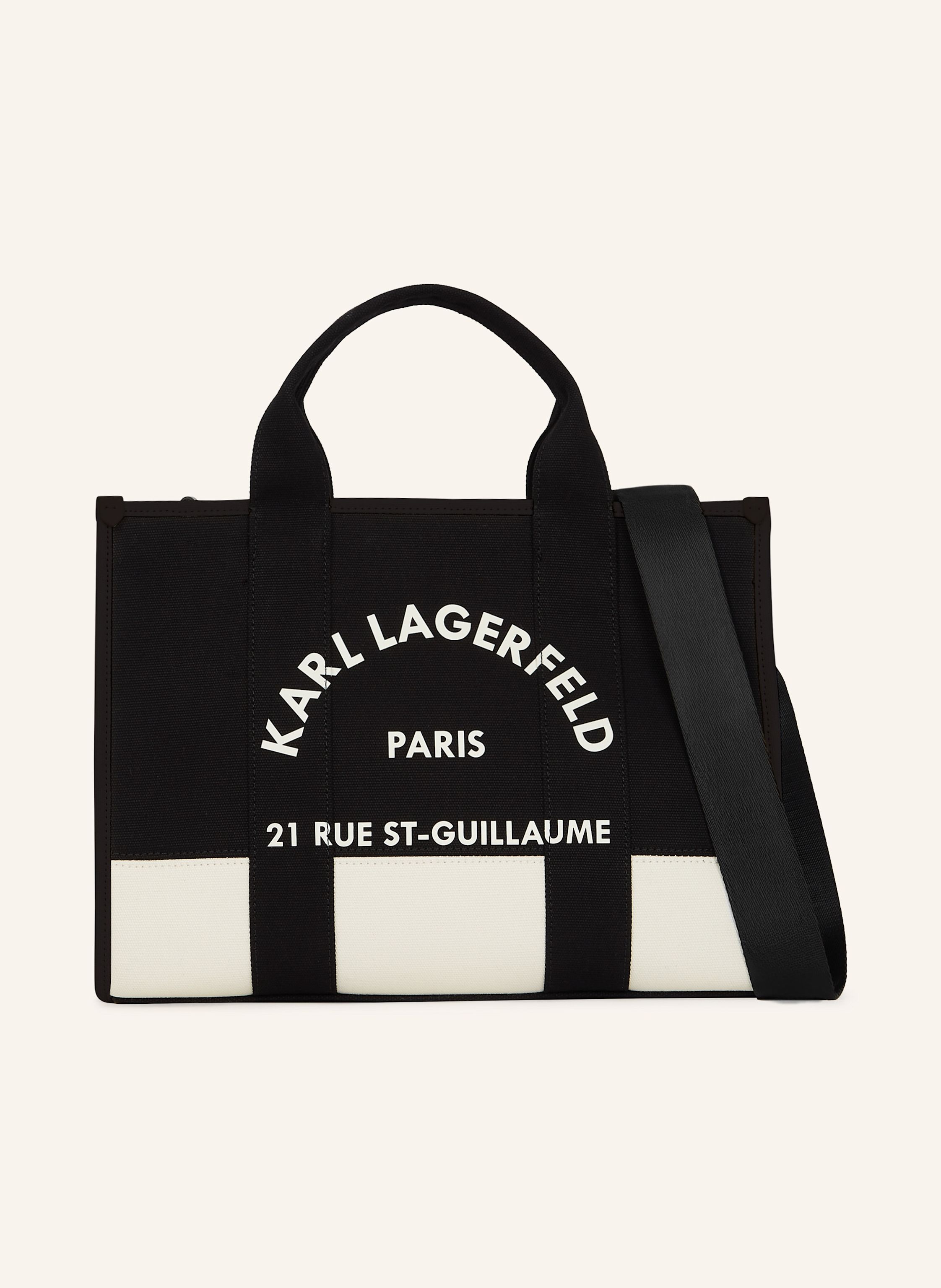 Karl Lagerfeld Eine zeitgenössische quadratische Silhouette prägt diese mittelgroße Tote-Bag mit sicherem Reißverschluss oben. Mit zwei Tragegriffen auf der Oberseite und einem abnehmbaren Riemen bietet sie vielseit in beige/ schwarz