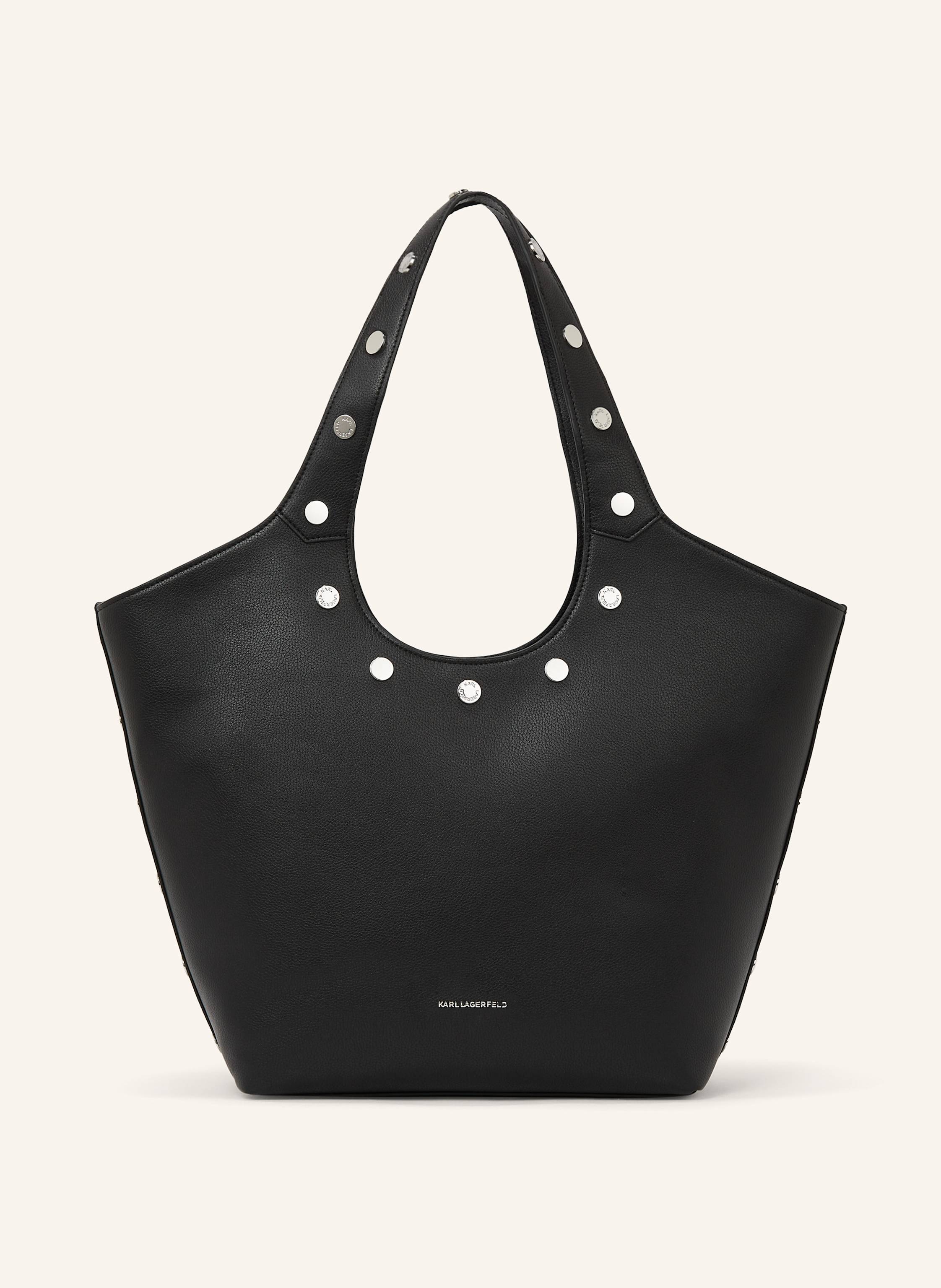 Karl Lagerfeld Diese elegante mittelgroße Tote Bag wird durch Rock-chic-Nieten und dezente KARL LAGERFELD-Beschläge aufgewertet. Die beiden Tragegriffe oben machen sie zum idealen Begleiter für das Stadtleben. Ein R in schwarz