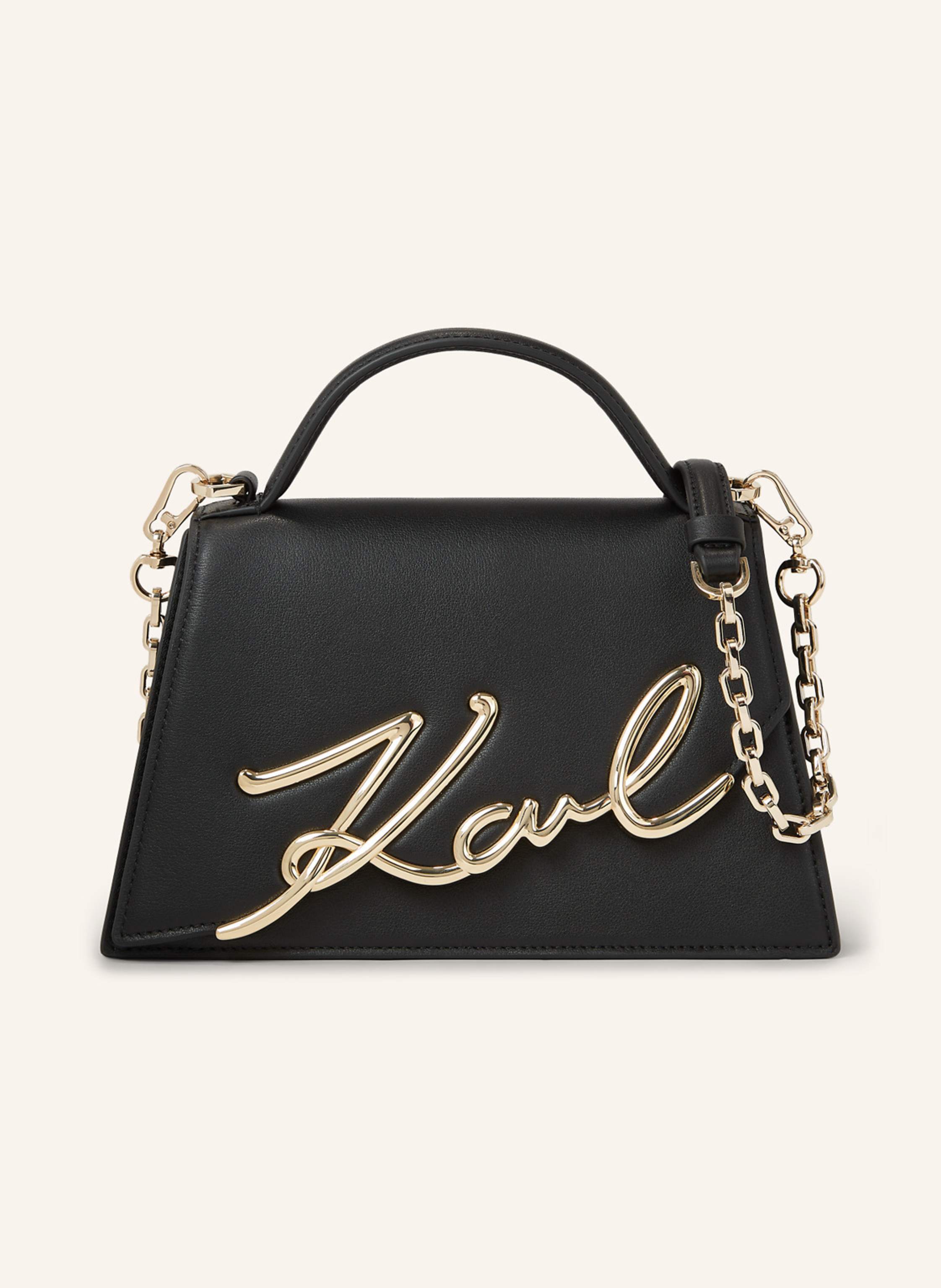 Karl Lagerfeld Die beliebte K/SIGNATURE Umhängetasche wird mit einem schräg platzierten Logo am Überschlag und einer trapezförmigen Silhouette feminin neu interpretiert. Dieses unbestreitbar schicke und stets prakti in schwarz/ gold