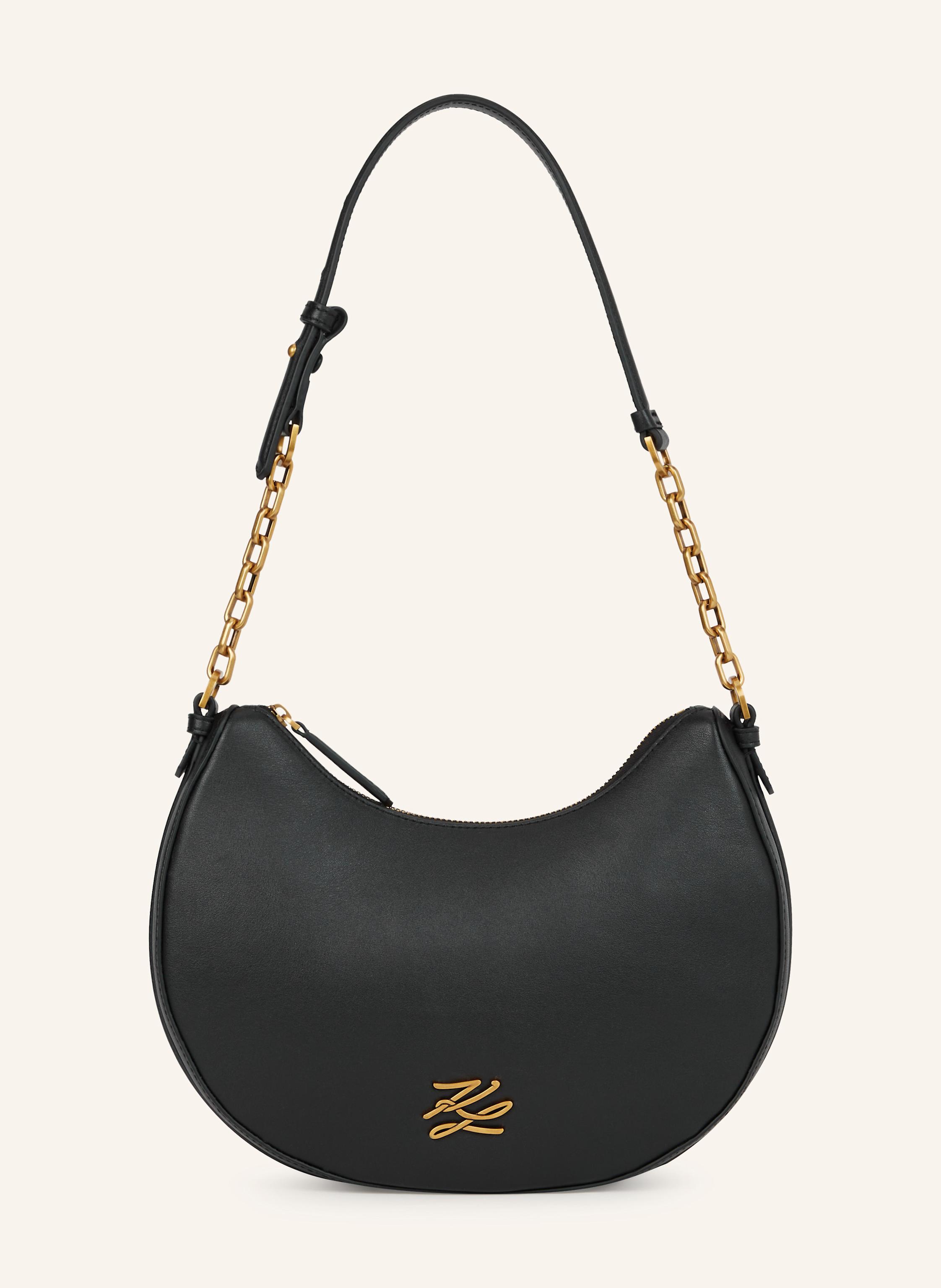 Karl Lagerfeld Eine zeitgenössische Mondsilhouette definiert diese Umhängetasche, die aus weichem Leder mit schicken Kettendetails gefertigt ist. Ein Reißverschluss sorgt für sichere Aufbewahrung wichtiger Utensilie in schwarz/ gold