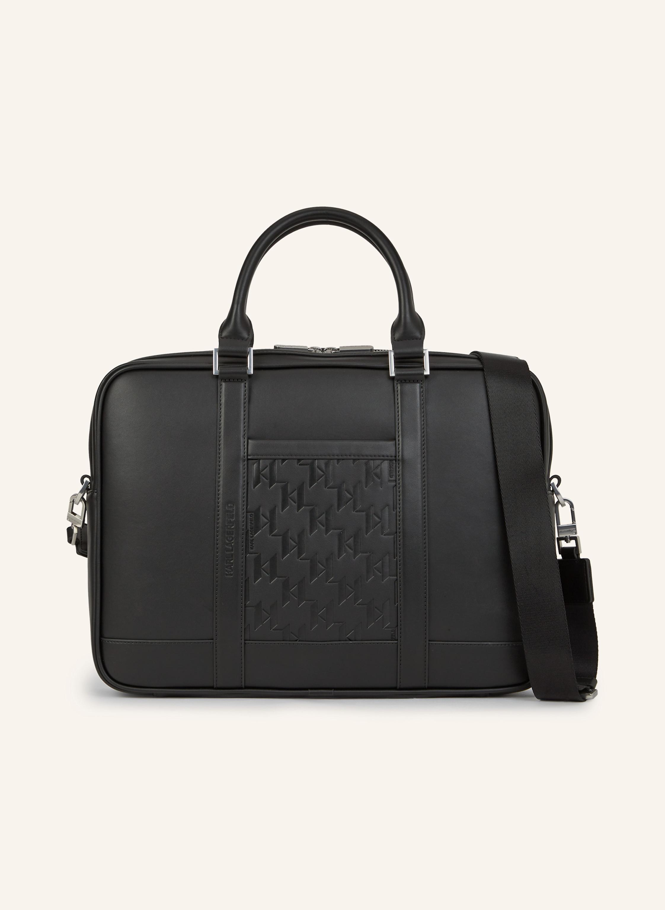 Karl Lagerfeld Diese klassische Aktentasche ist ein unverzichtbarer Begleiter für Geschäftsreisen. Sie ist mit einem vielseitigen Riemen, der dafür sorgt, dass die Hände beim Tragen frei bleiben, und einer praktisch in schwarz