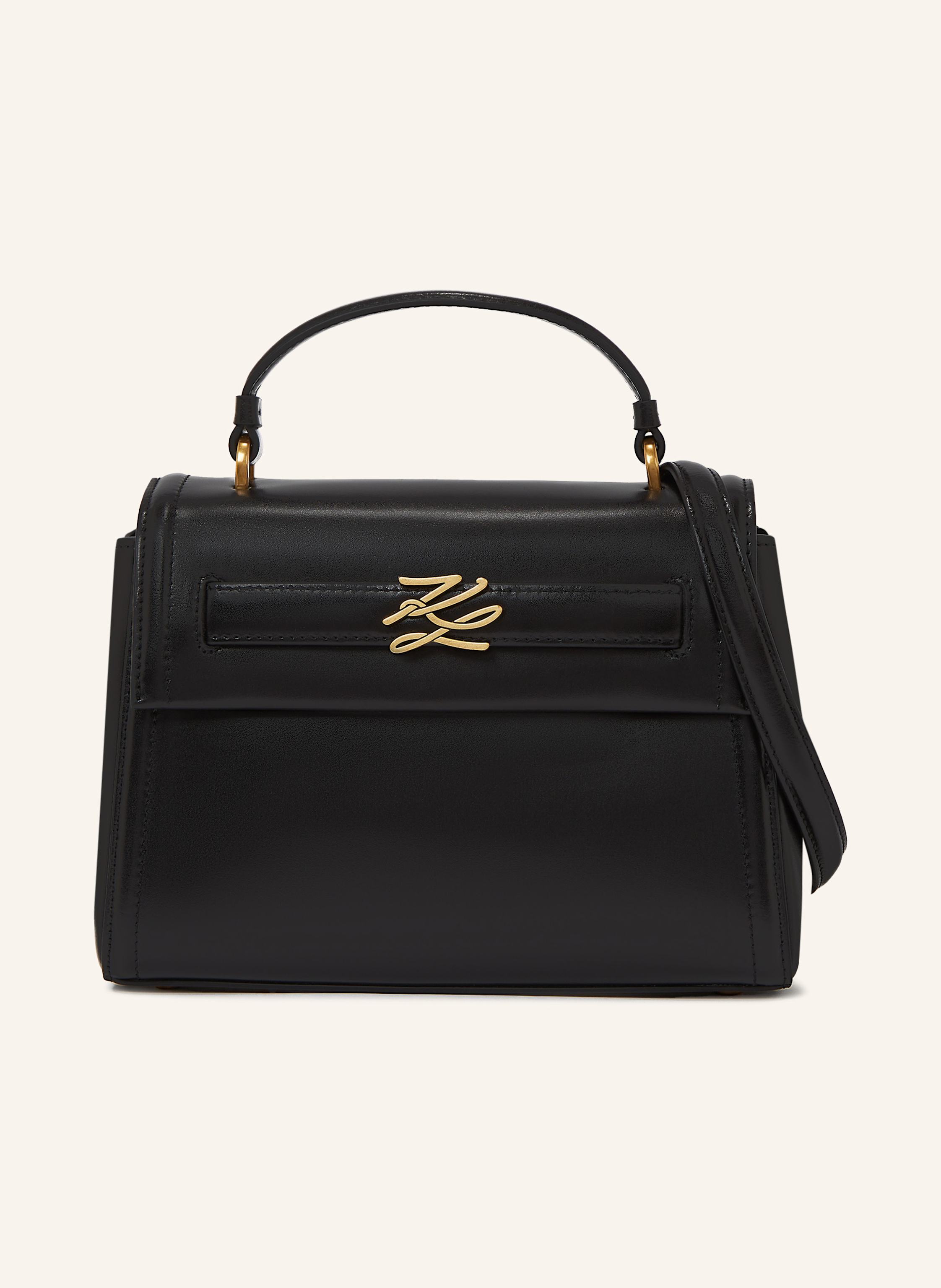 Karl Lagerfeld Diese elegante Handtasche mit oberem Tragegriff in Trapezform aus hochwertigem Leder strahlt zeitlosen Stil aus. Ein verstellbarer Riemen ermöglicht individuelles Tragen, während die Karl Autograph-Ha in schwarz/ gold