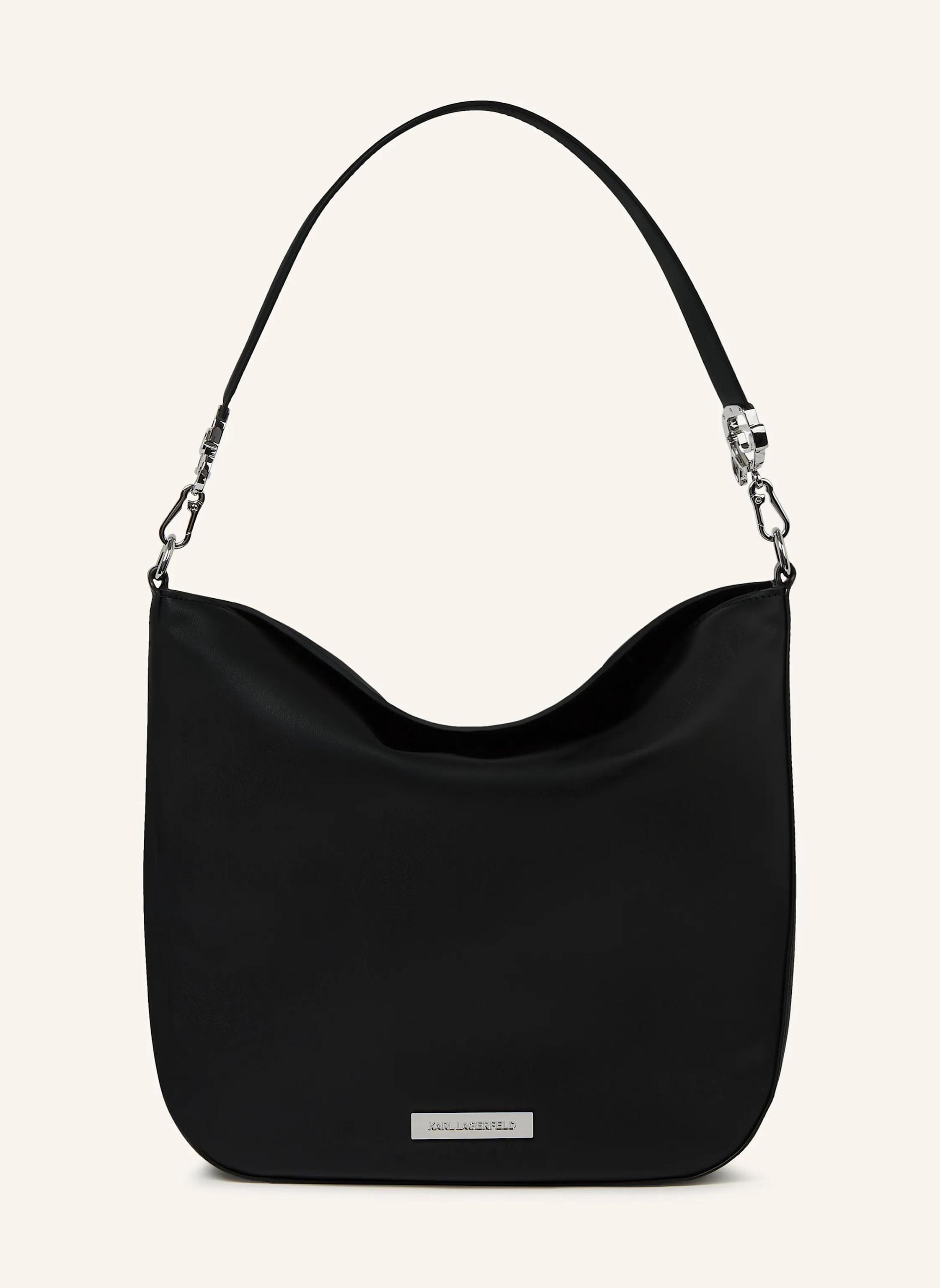 Karl Lagerfeld A contemporary slouchy hobo bag that balances relaxed ease with refined details. Its soft structure and playful metal attachments bring personality to everyday essentials. Magnetic closure keeps belon in schwarz