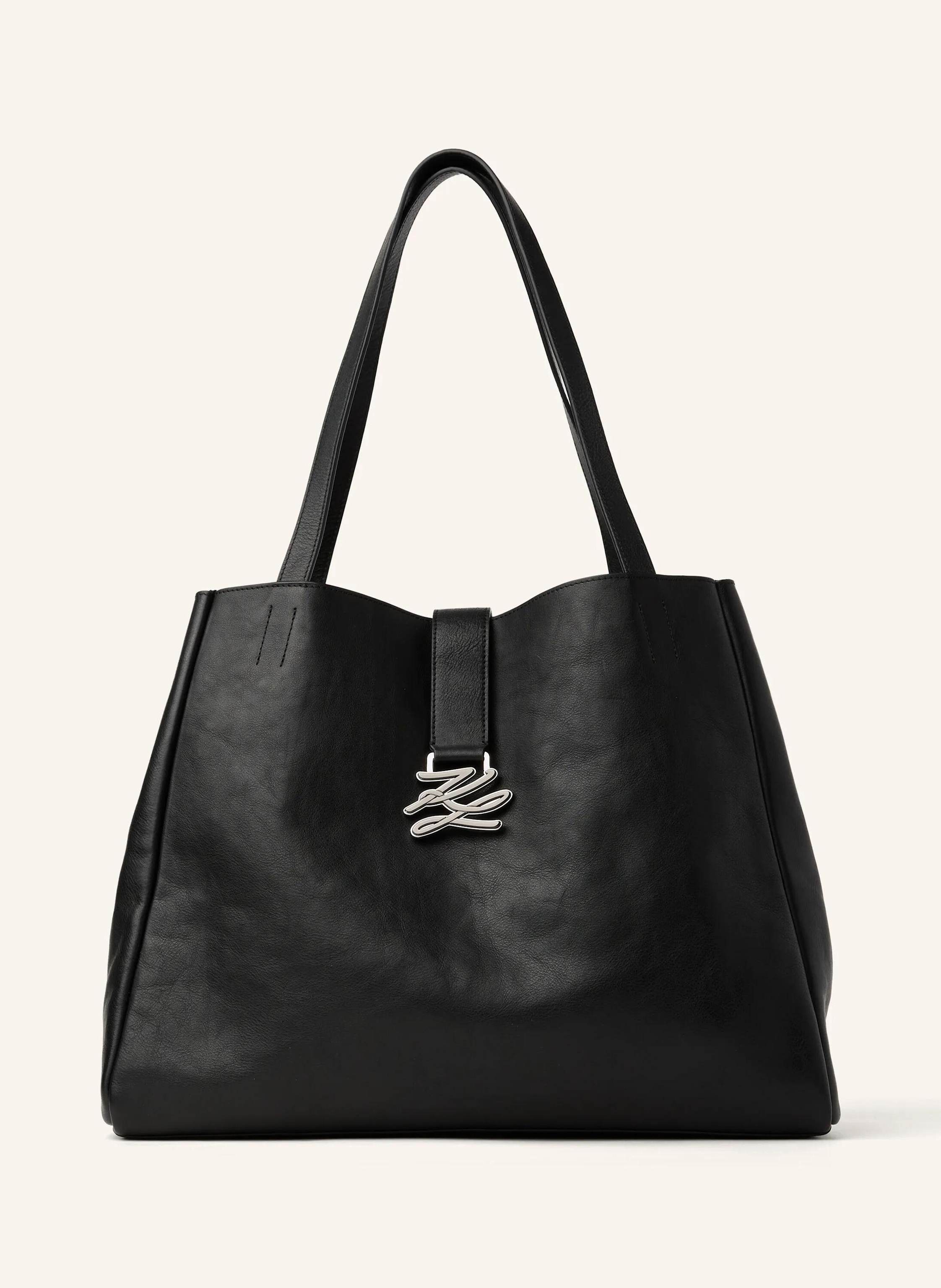 Karl Lagerfeld A contemporary slouchy tote designed for effortless style and function. Soft cow leather with a comfortable shoulder strap and a metal Karl Autograph logo detail. Perfect from work to weekend. Contemp in schwarz