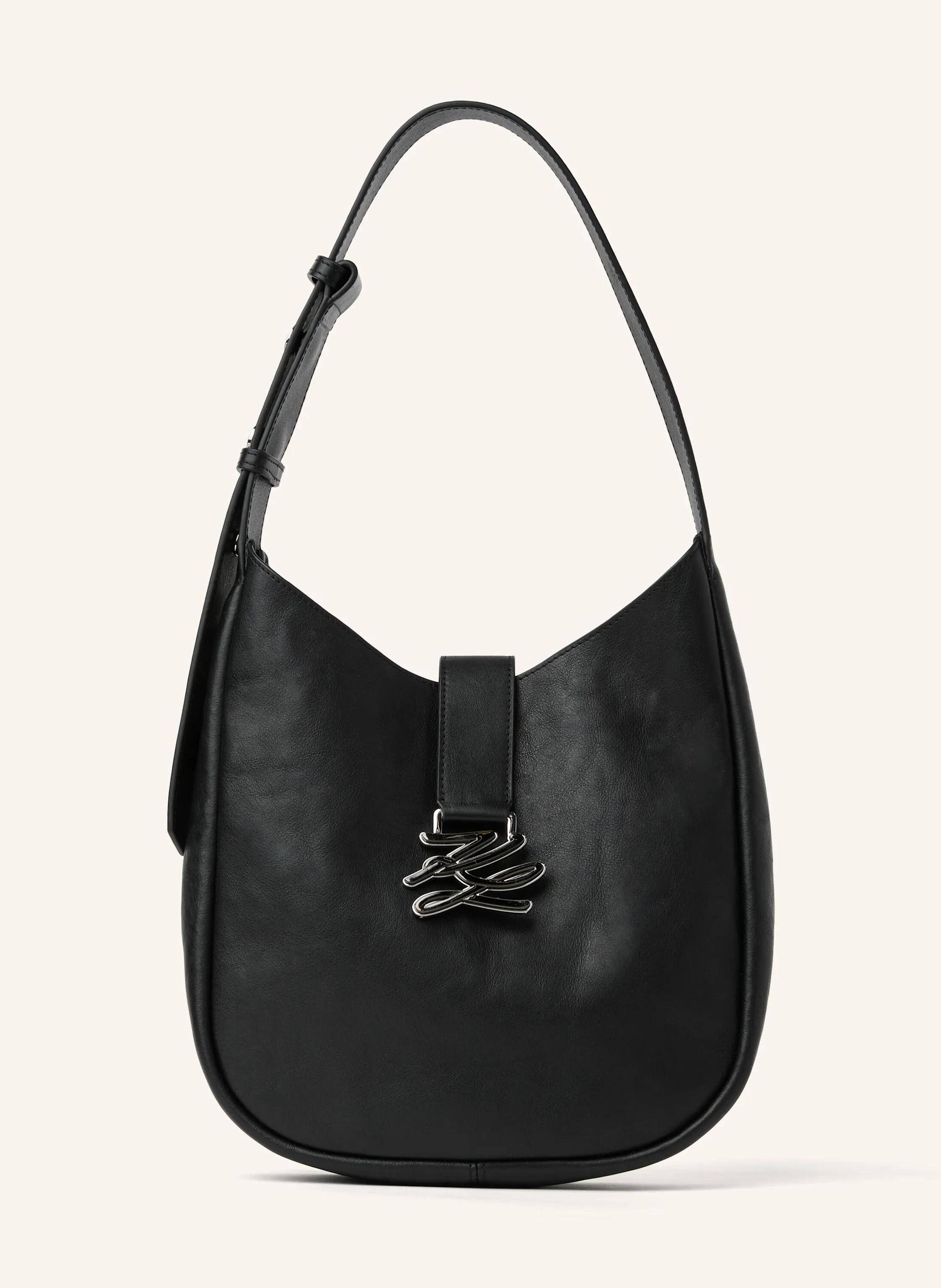 Karl Lagerfeld A contemporary slouchy hobo bag that redefines relaxed luxury. Its supple cow leather and adjustable strap offer effortless comfort. The metal Karl Autograph logo adds a refined signature detail. Perf in schwarz